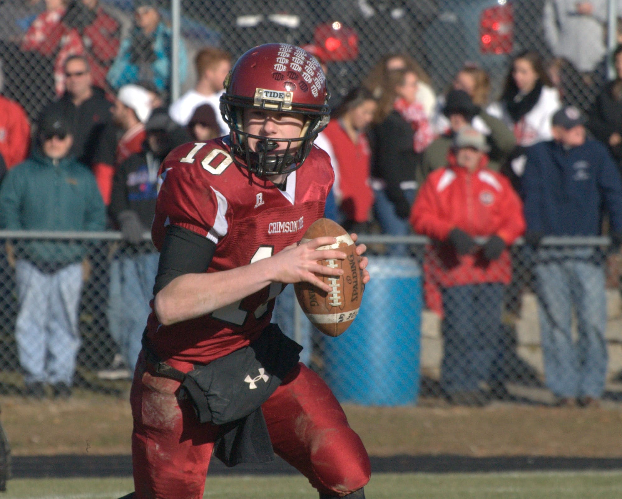 Concord quarterback Robert Law rolls out of the pocket during Saturday's game.