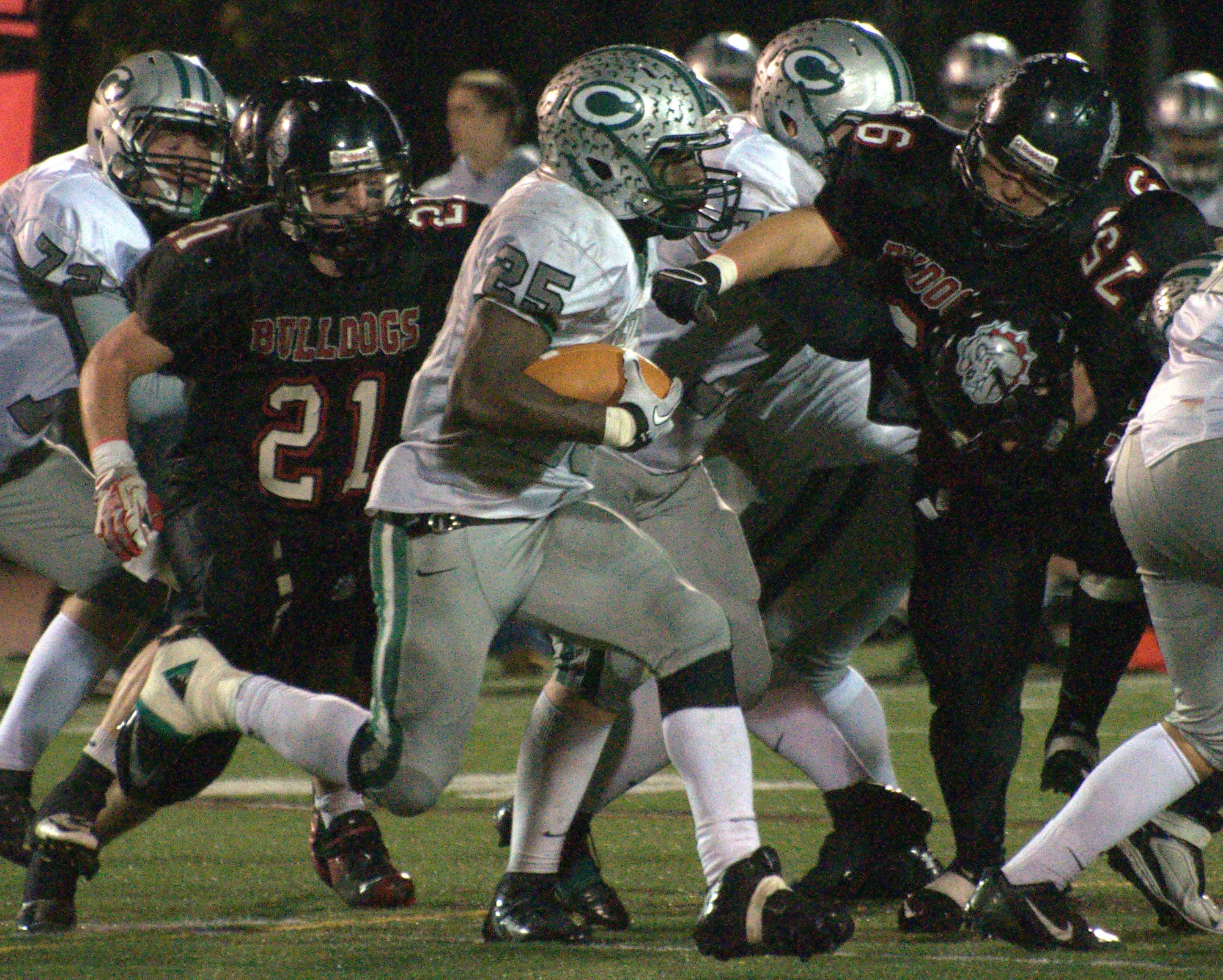 Manchester Central's Jesiah Wade runs through the Bedford defense during Friday's game.