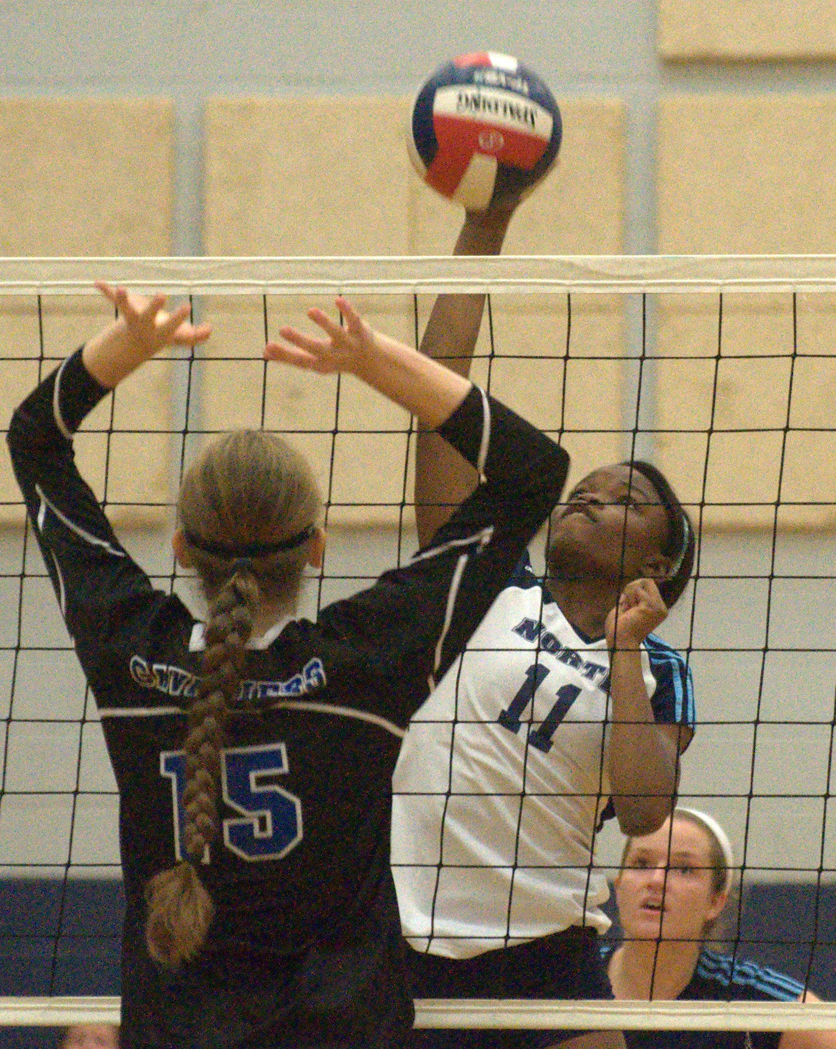 Nashua North's Adaeze Okorie hits the ball during Thursday's match against Hollis Brookline.