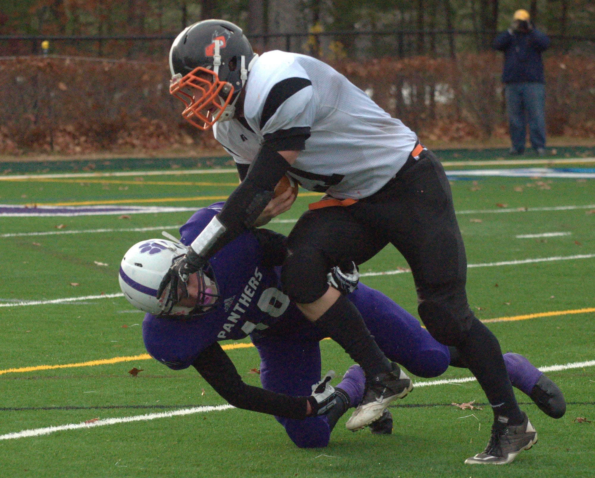 Keene's Alex Parenteau runs over Nashua South's Robbie Smyth during Saturday's playoff game.