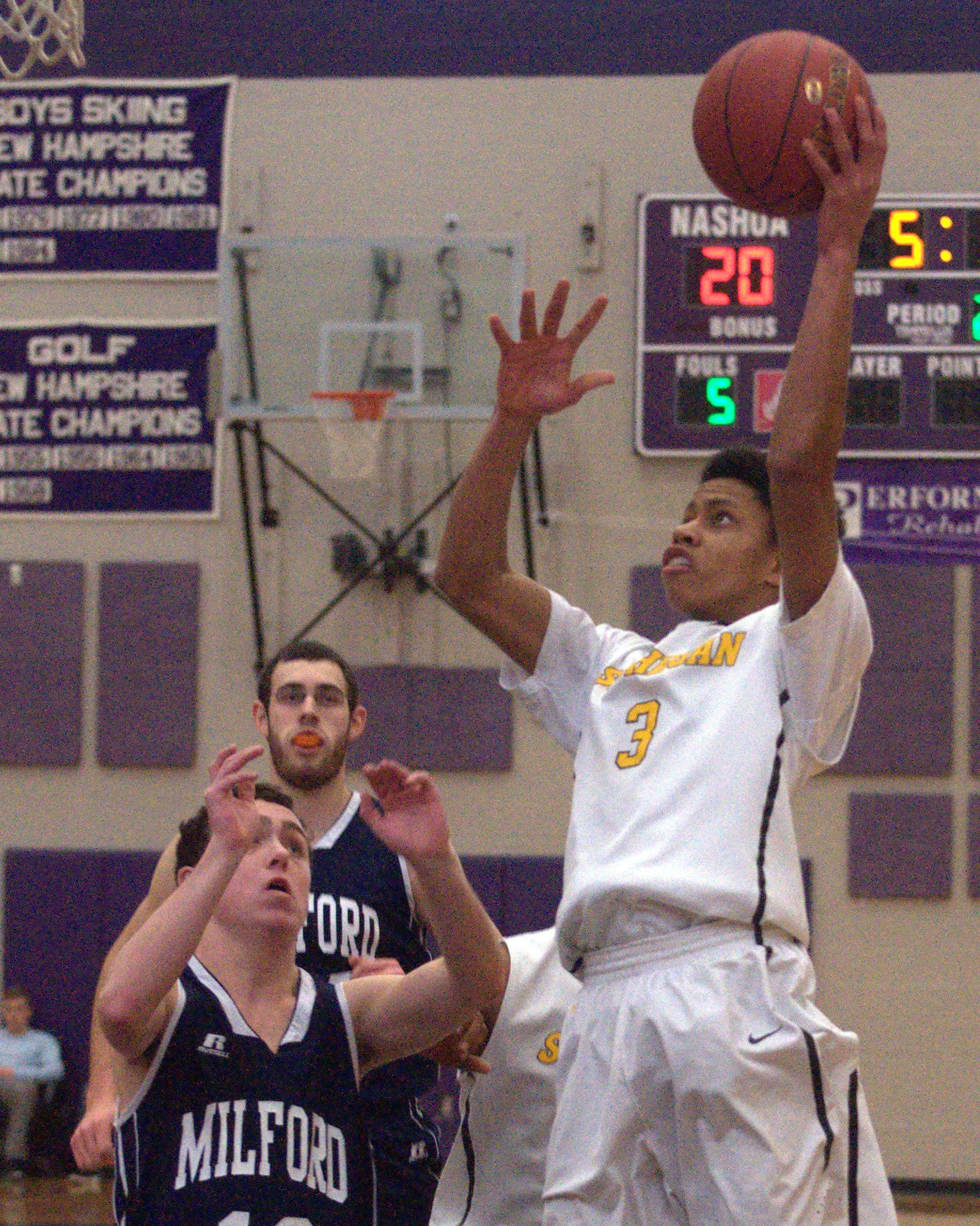 Souhegan's A.J. Hayes goes in for a layup during Thursday's game against Milford.
