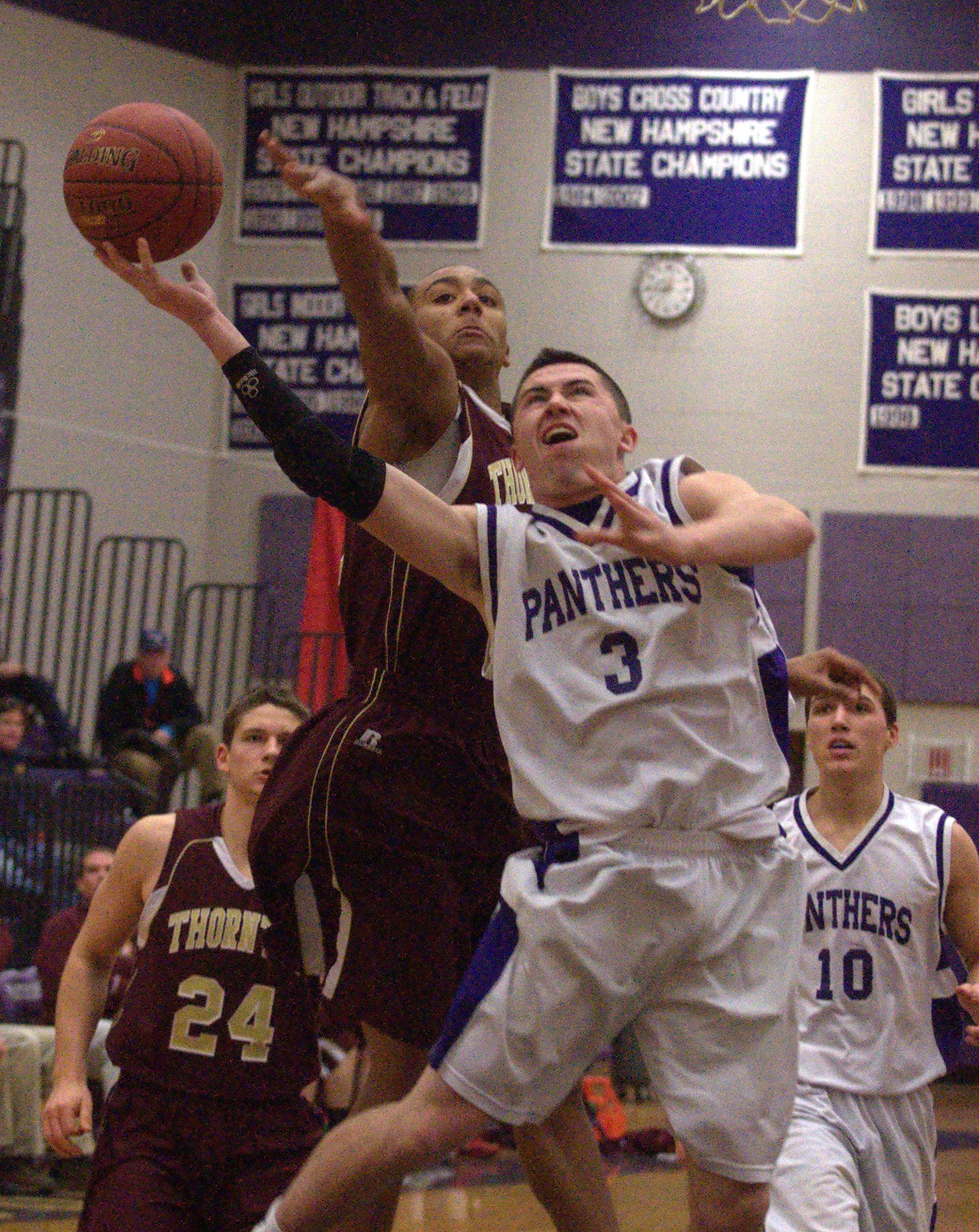Nashua South's Trevor Knight gets fouled by Thornton Academy's Corey Hart during Friday's game.