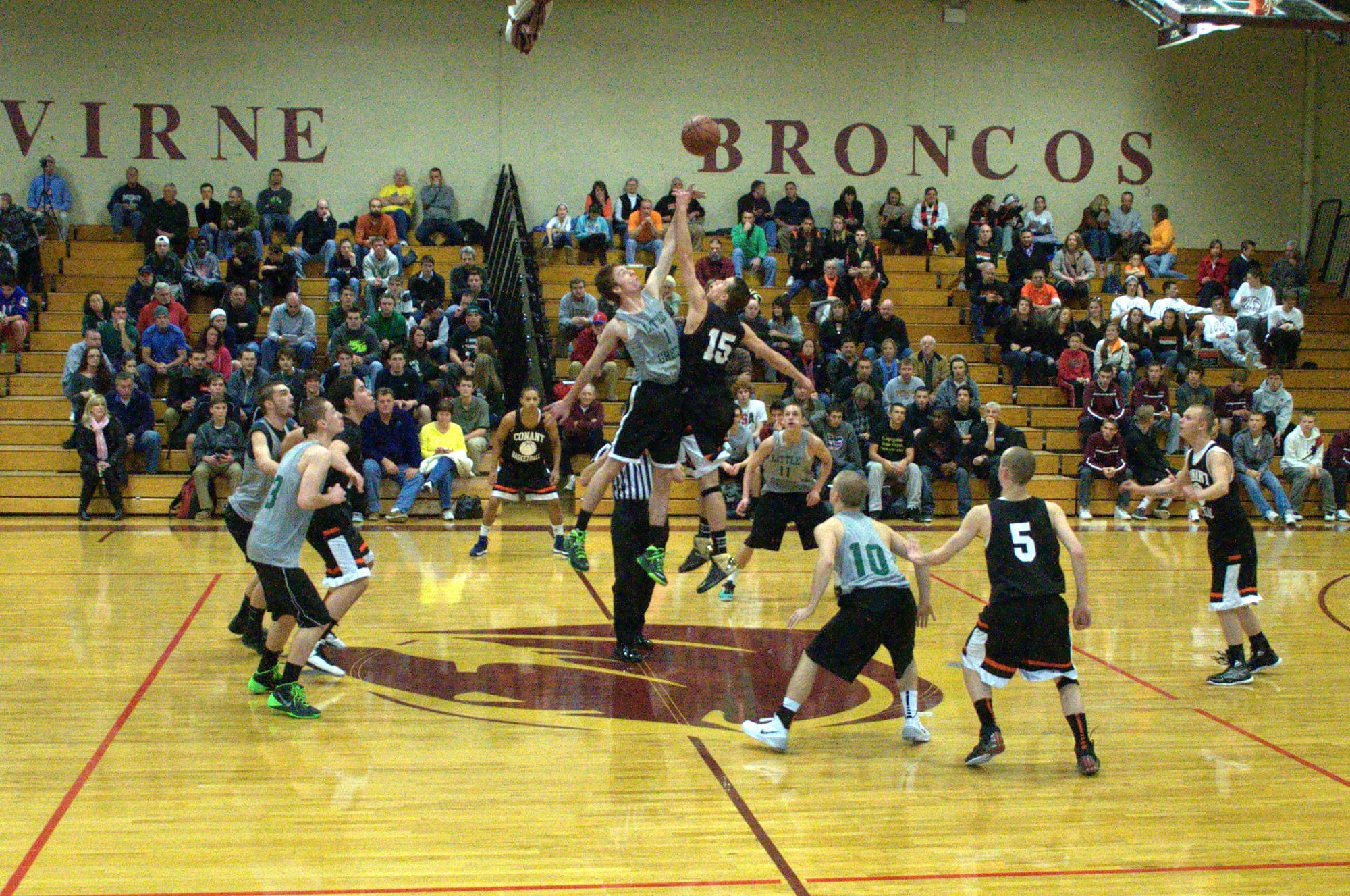 Manchester Central and Conant tip off Saturday during the Coaches For A Cause Jamboree at Alvirne High School.