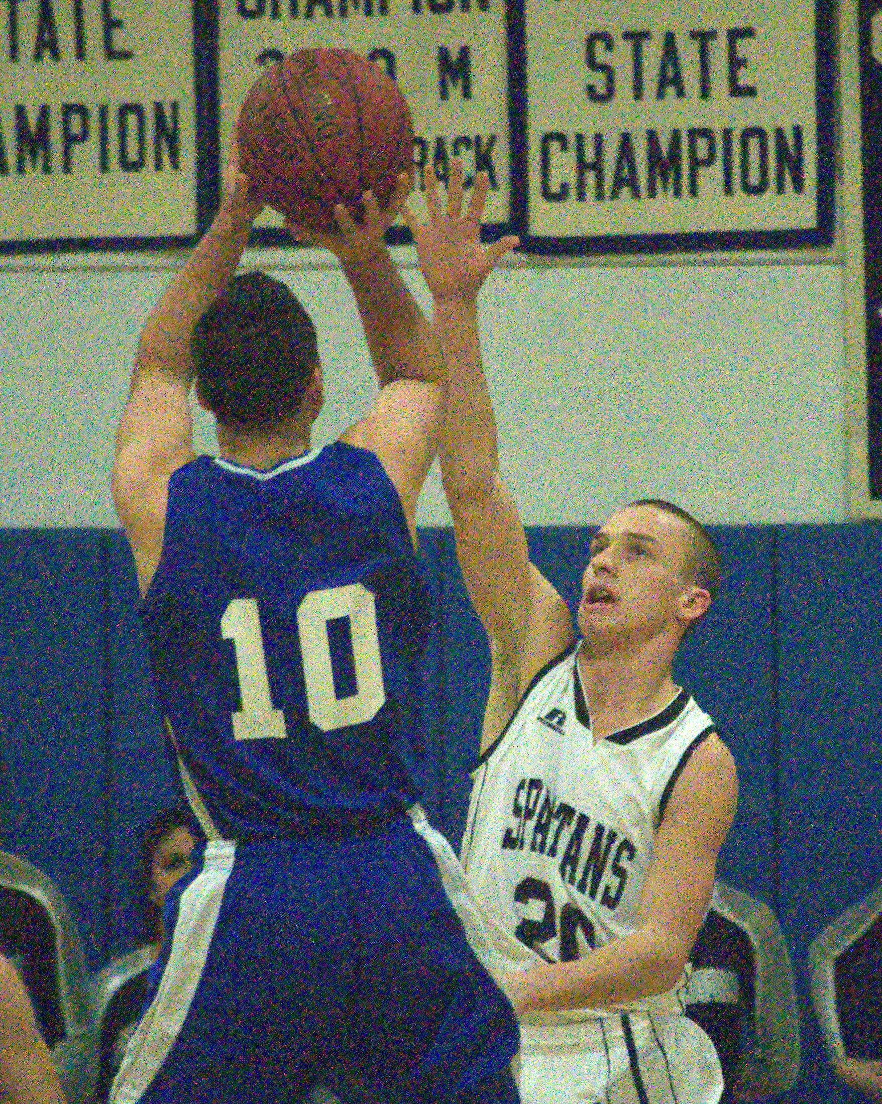 Pelham's Jake Vaiknoras shoots over Milford's Mitch Banuskevich during Wednesday's game.