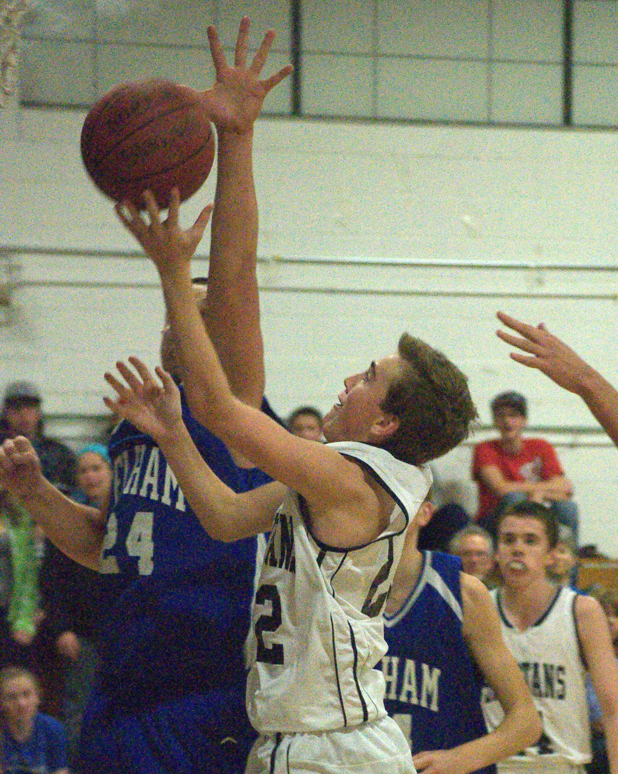 Pelham's Keith Brown tries to block a shot by Milford's Jack Briggs during Wednesday's game.