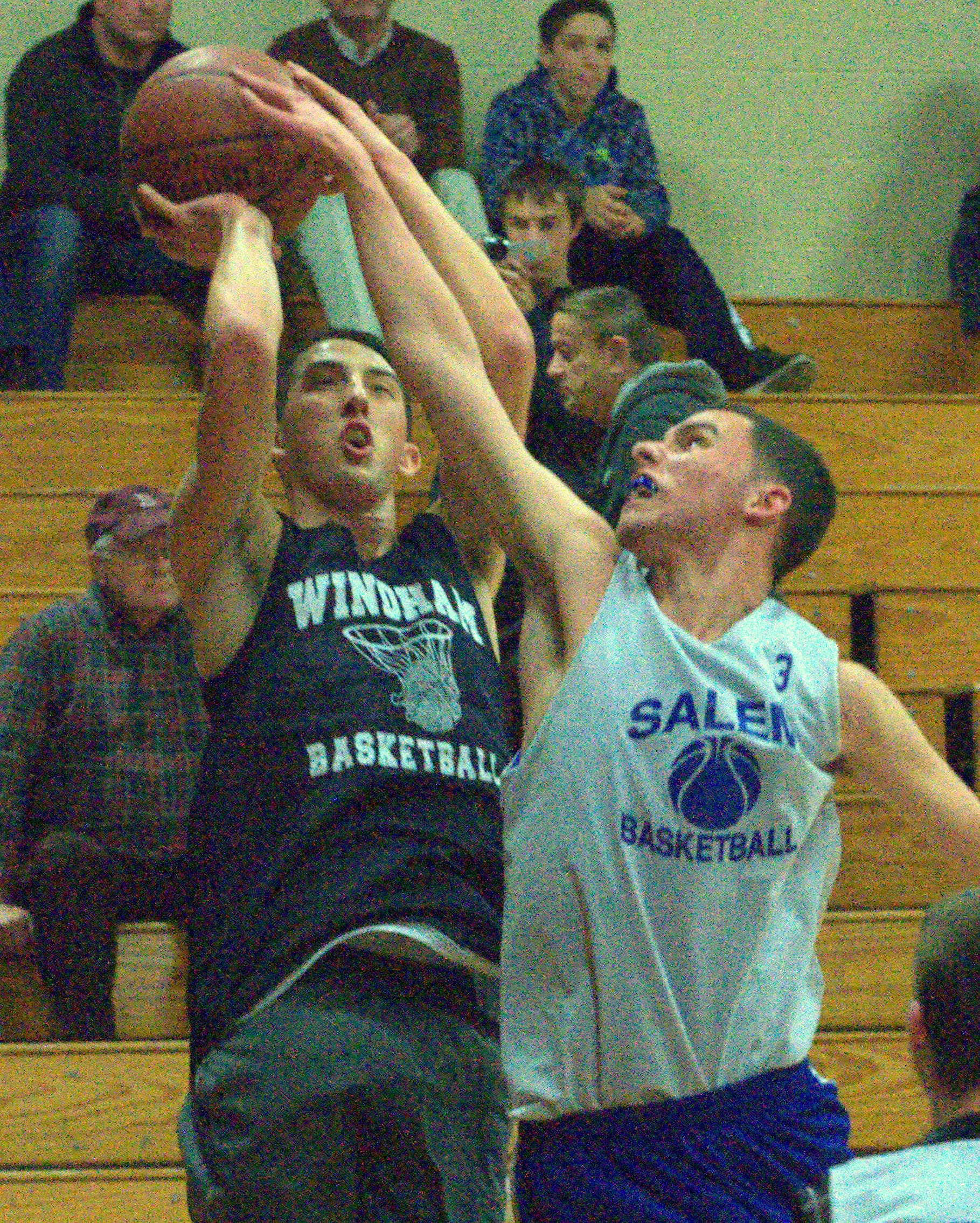 Salem's Danny Nugent tries to block a shot by Windham's Andrew Lowman during Friday's action.