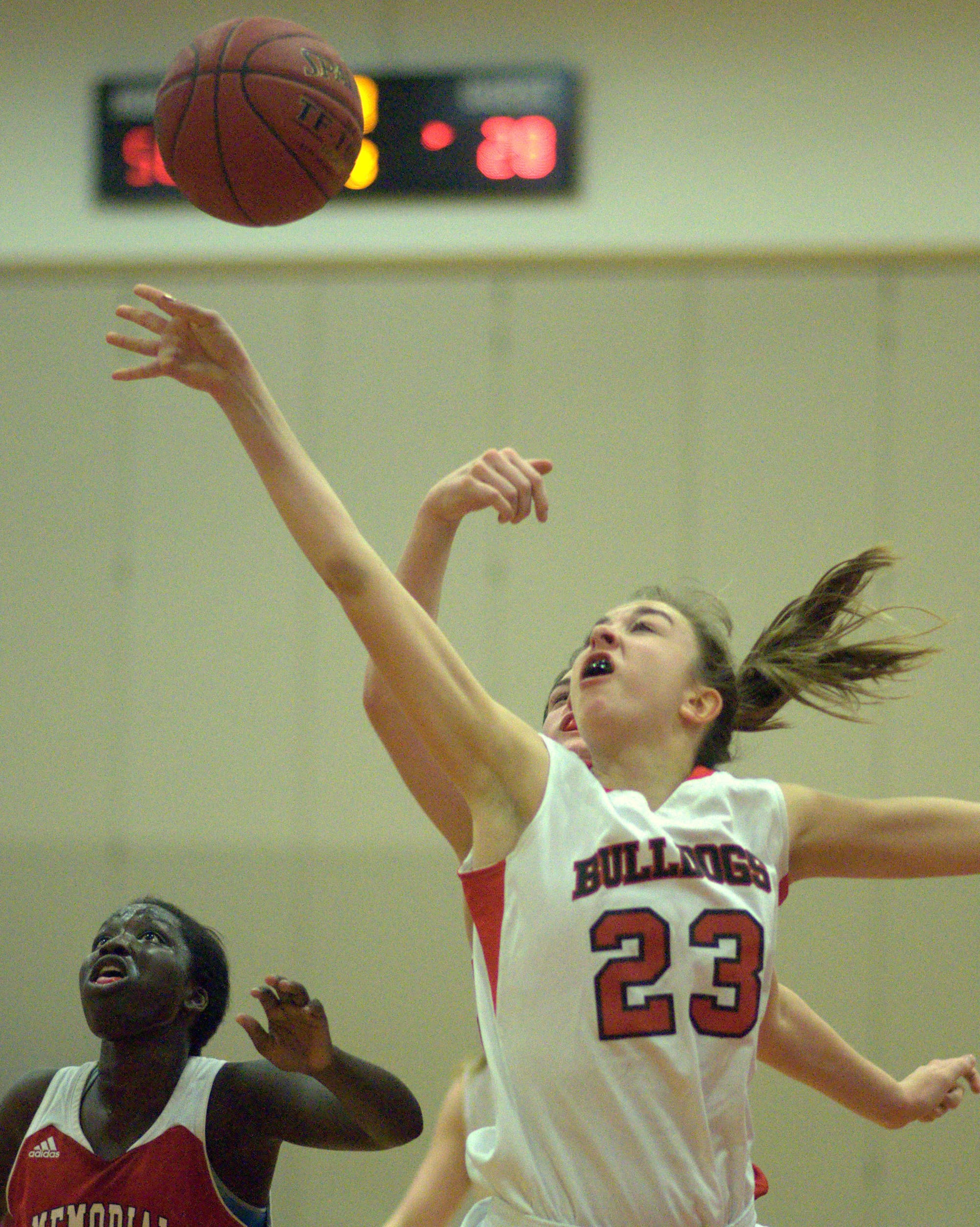 Bedford's Ali Glennon is fouled on her way to the basket.