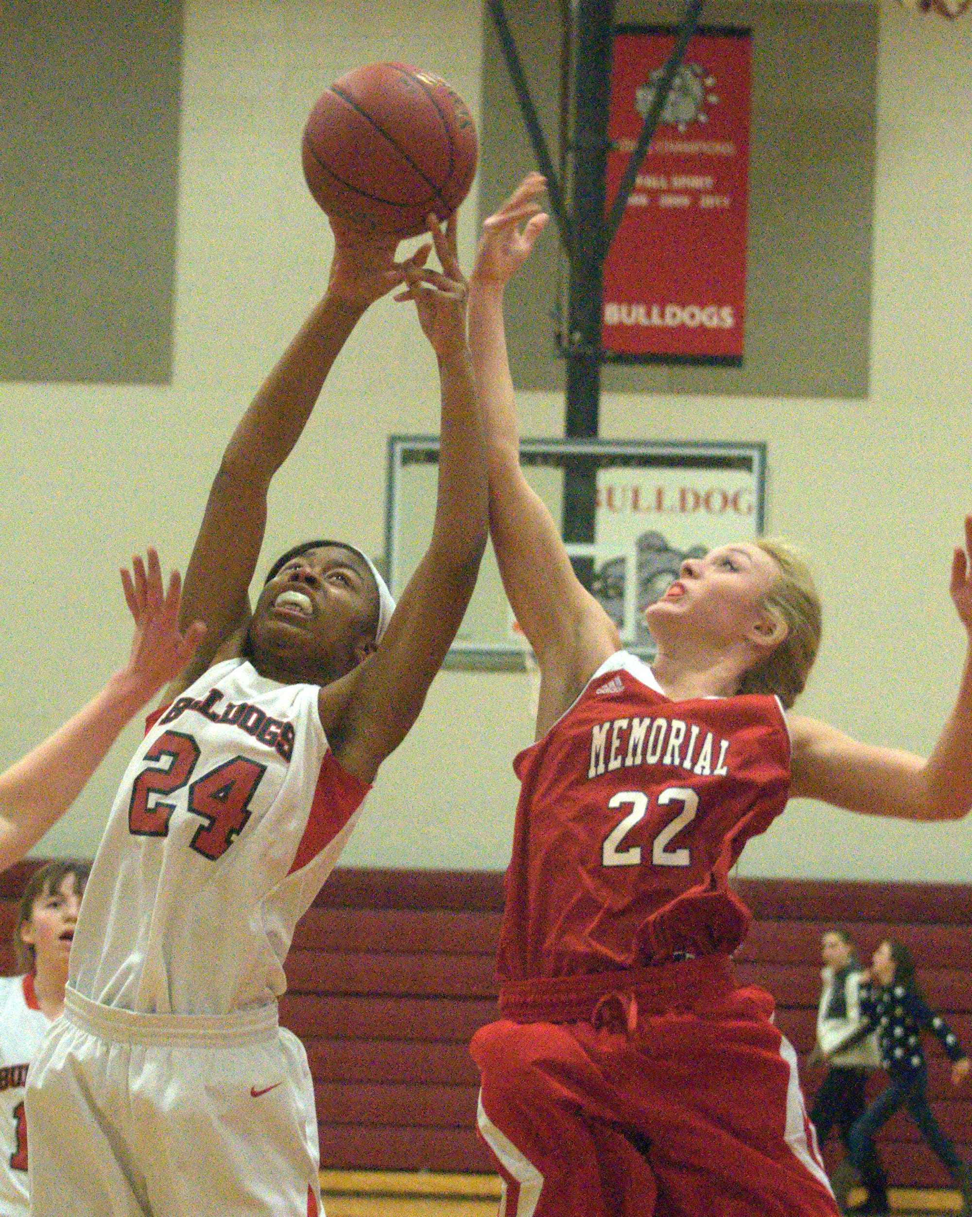 Bedford's Gabby Hunter and Manchester Memorial's Jess Sweetser battle for a rebound during Wednesday's game.