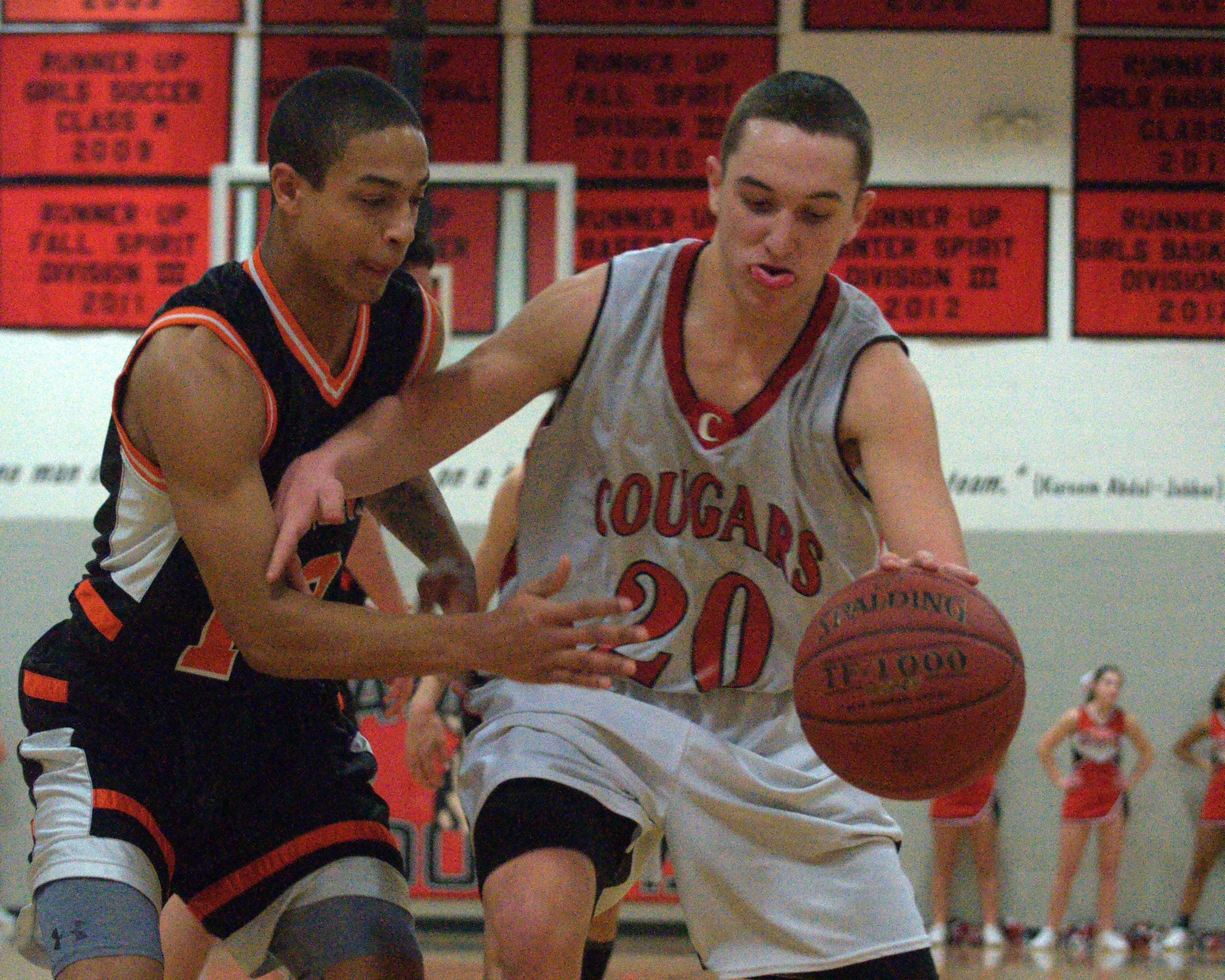 Campbell's Andrew Smarse tries to keep the ball away from Conant's Kyle Carland.