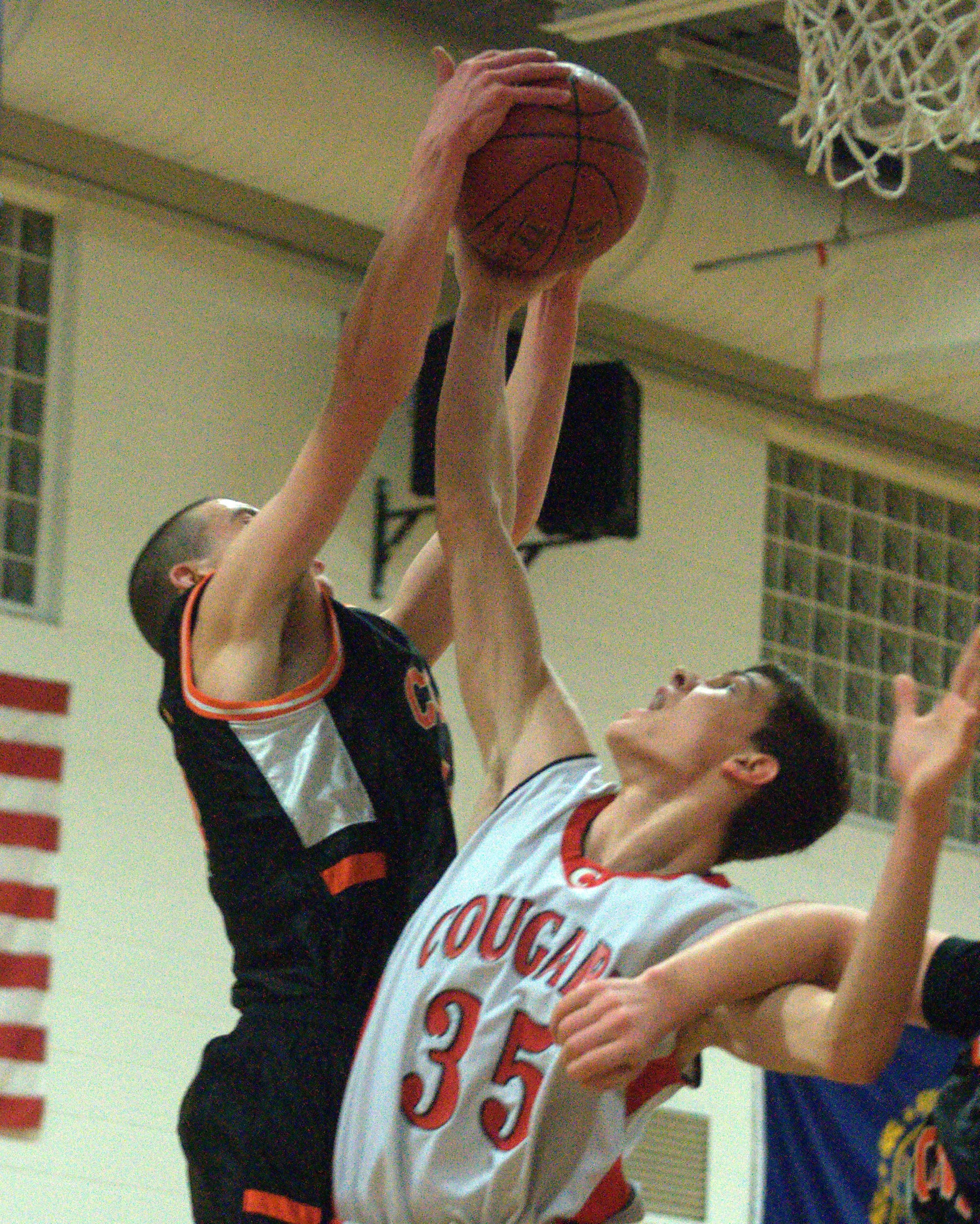 Conant's Robert O'Brien and Campbell's Zach Bergeon battle for a rebound during Monday's game. For more photos, go to the Photo Album.
