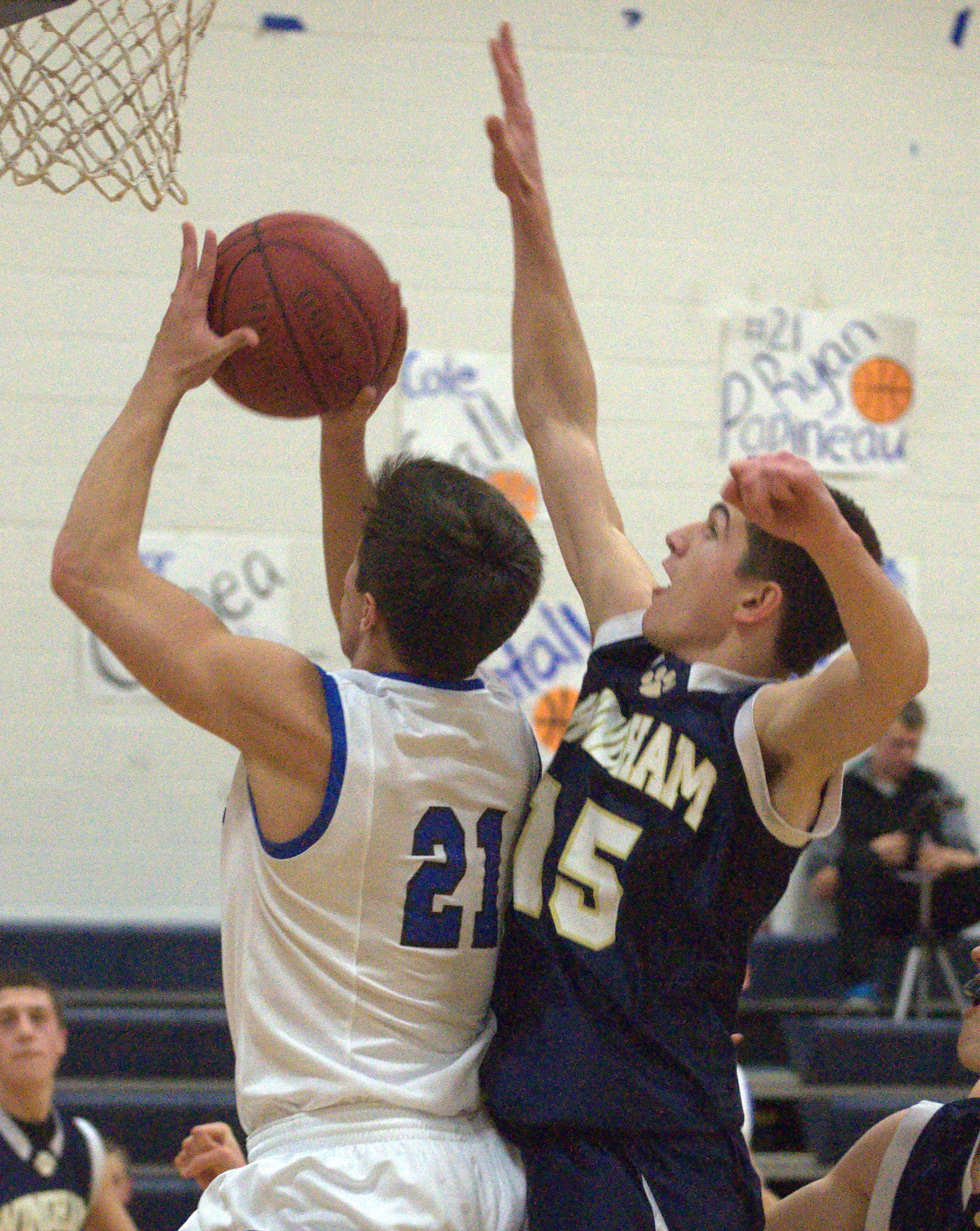 Windham's David Carbonello tries to block a shot by Hollis Brookline's Ryan Papineau during Tuesday's game. For more photos, go to the Photo Album.