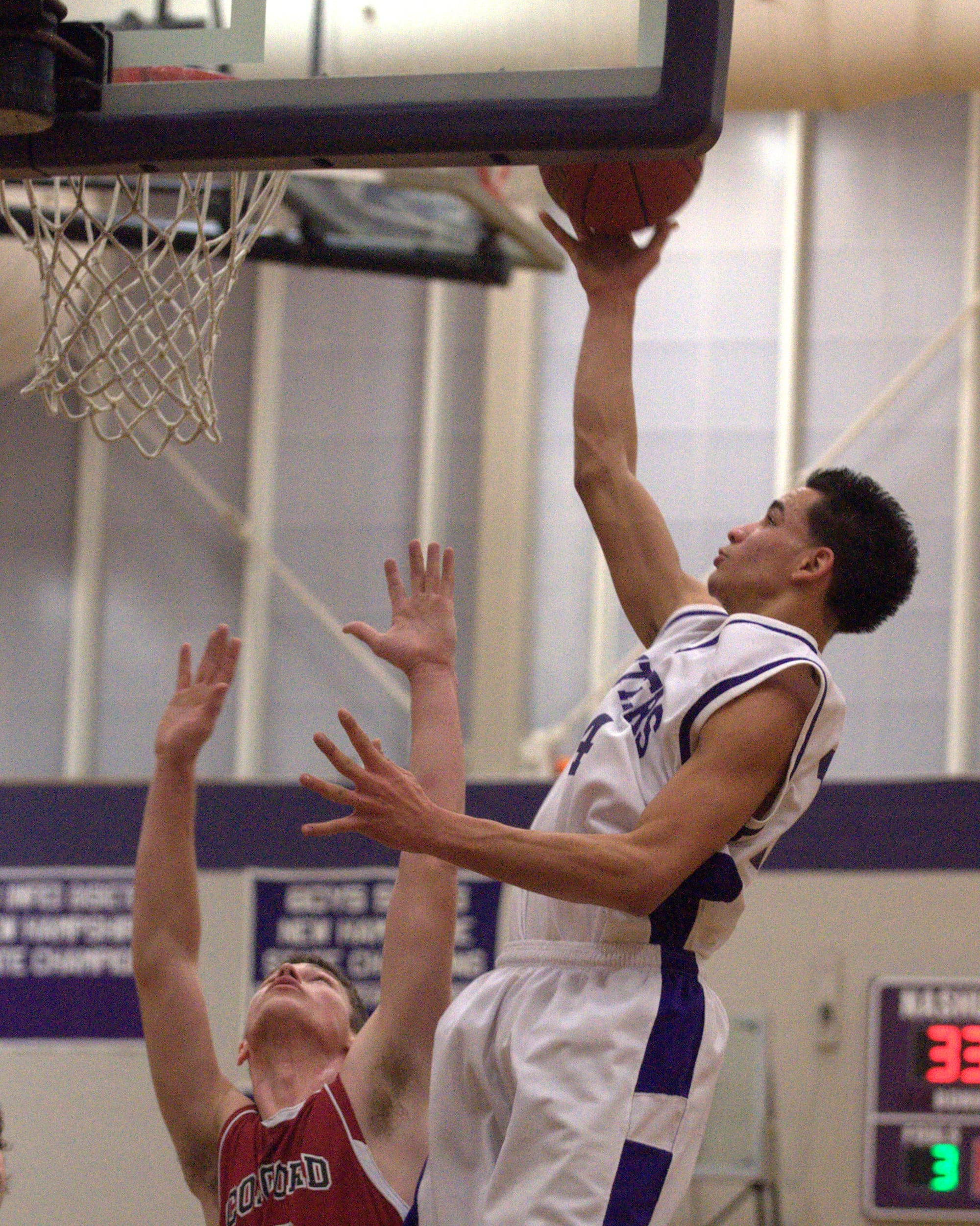 Nashua South's Yordy Tavarez goes in for a layup during Wednesday's game against Concord.