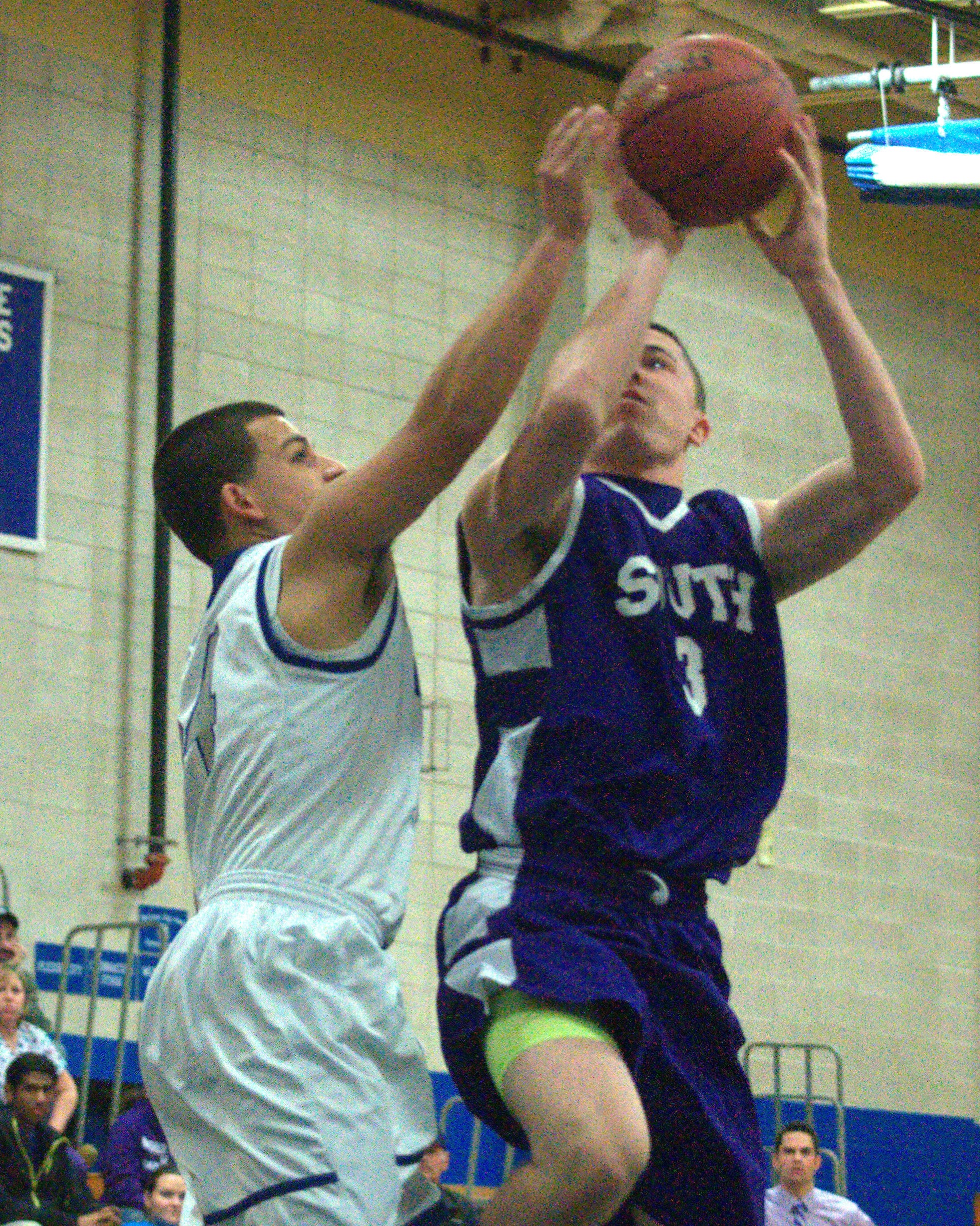 Merrimack's Mickey Gasper tries to slow down Nashua South's Trevor Knight as he heads to the basket.