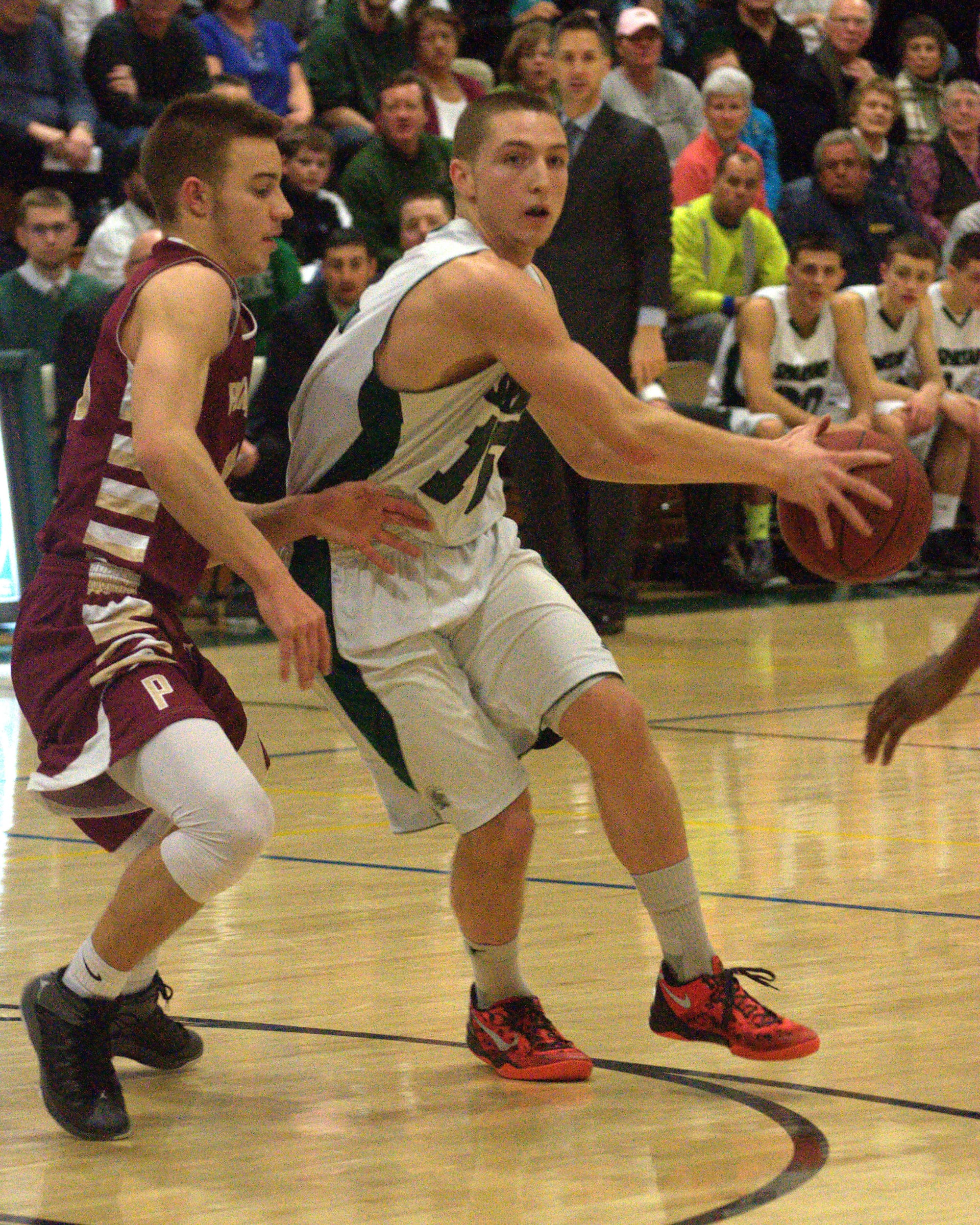 Pembroke's Patrick Welch tries to find an opening as Portsmouth's Nick Mackey defends during Thursday's game.