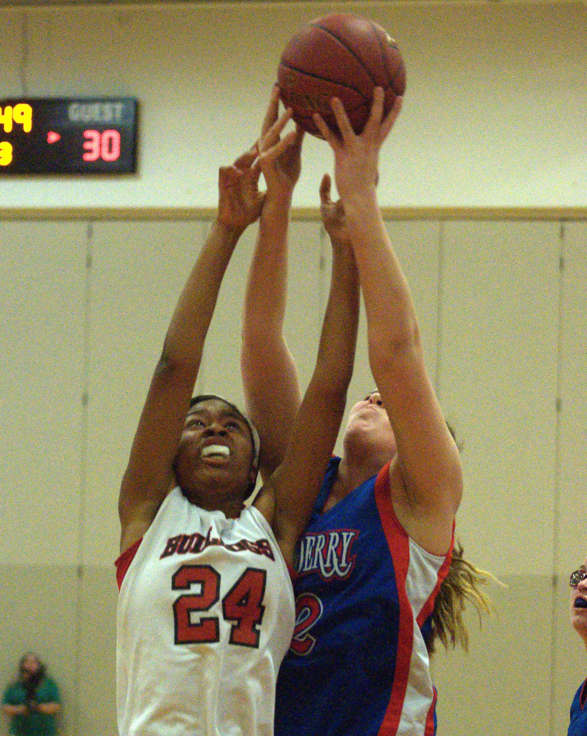 Bedford's Gabby Hunter battles for a rebound with Londonderry's Ashley Berube during Wednesday's game.