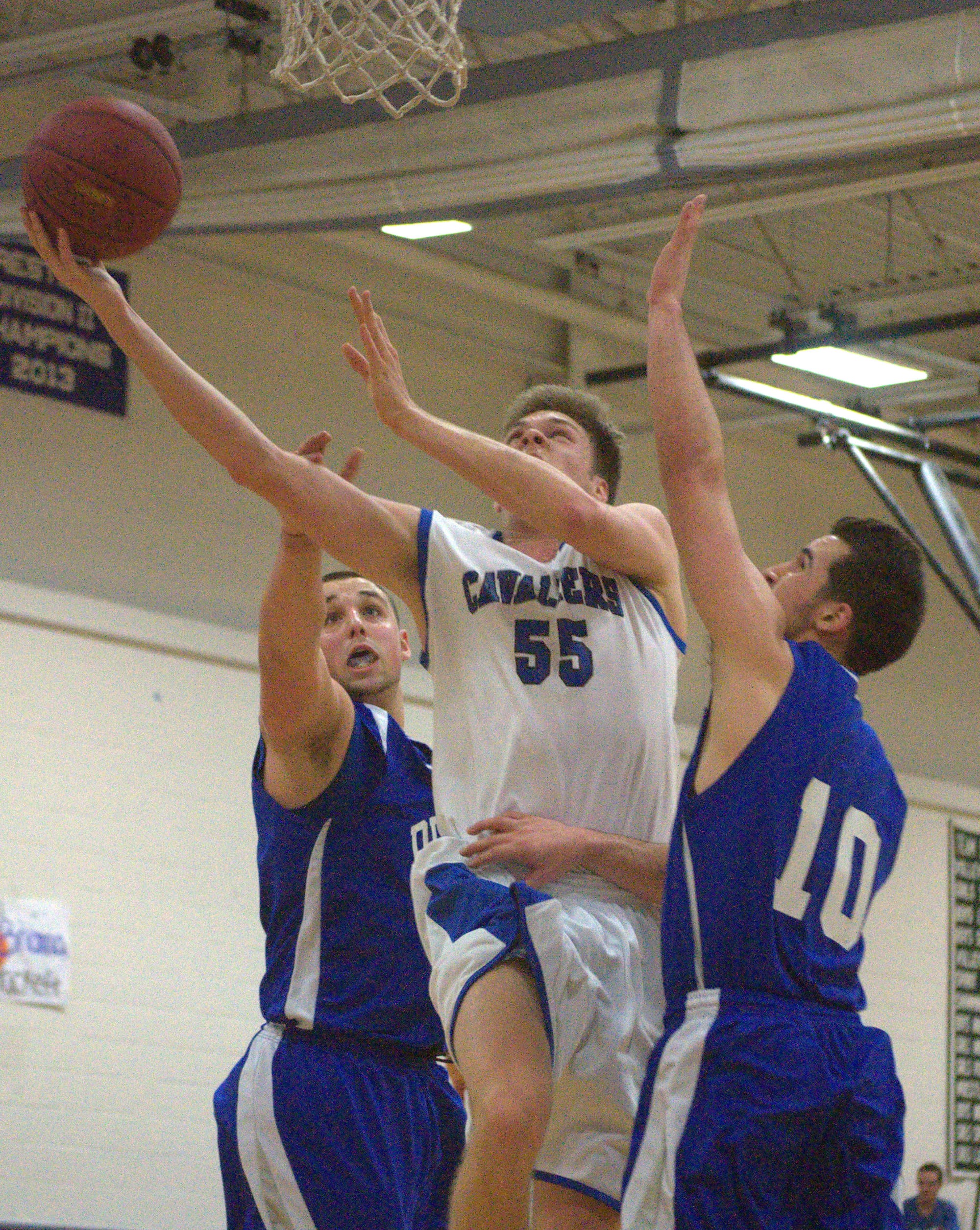Hollis Brookline's Shea Whalen goes in for a layup.