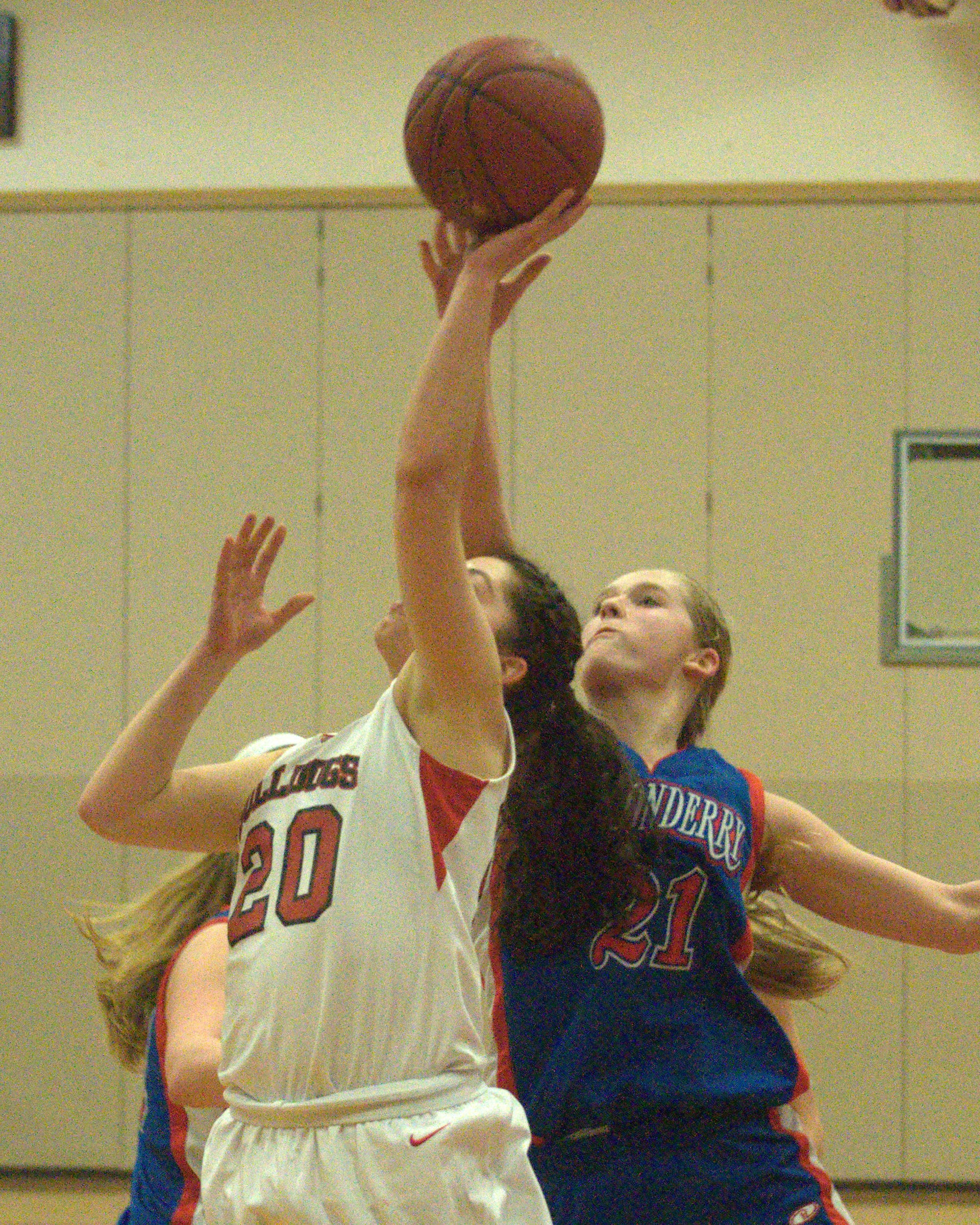Londonderry's Kelsey Coffey blocks a shot by Bedford's Nikki Tucci.
