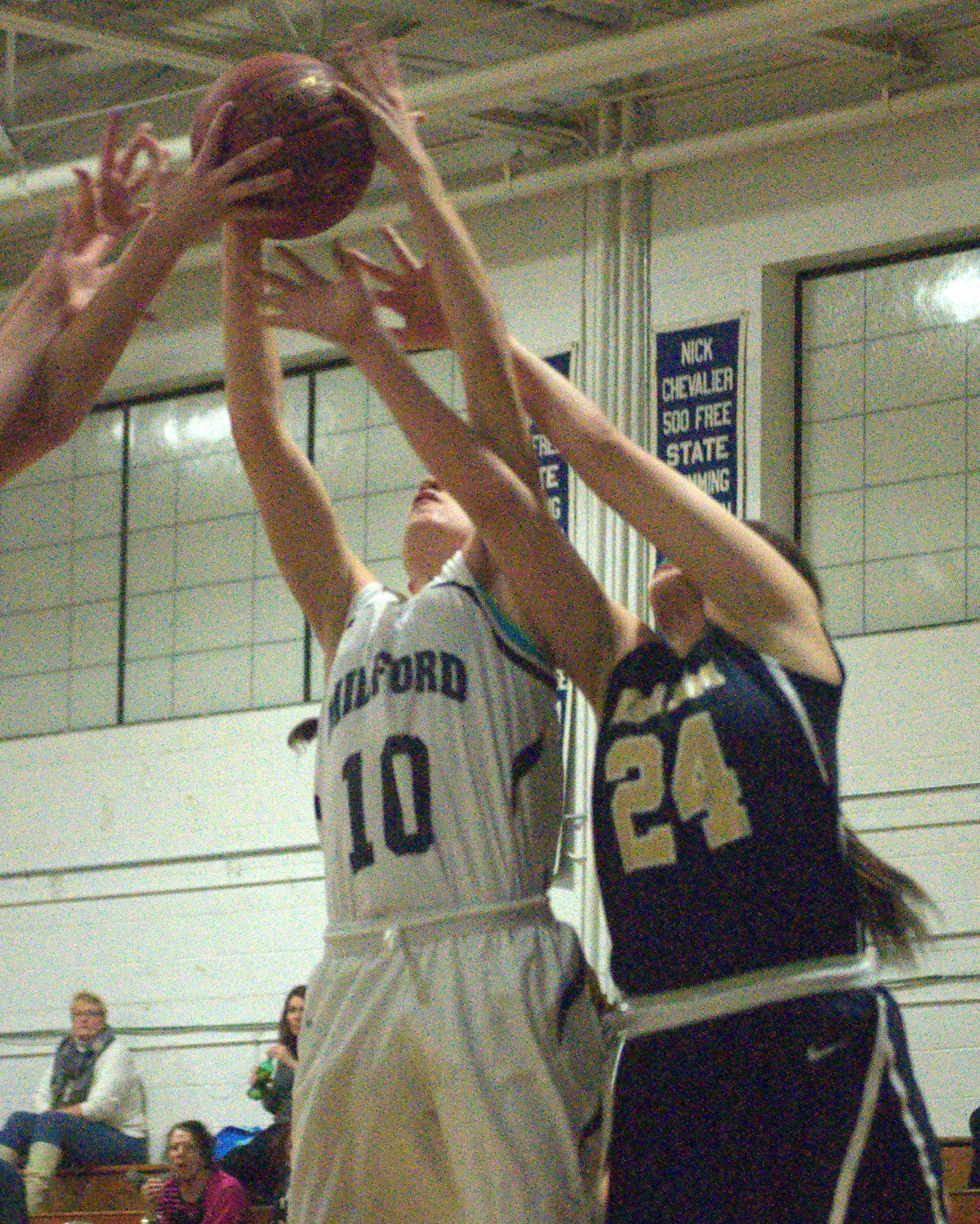 Milford's Devany Pitsas, left, and Windham's Lexi Sawyer battle for a rebound.