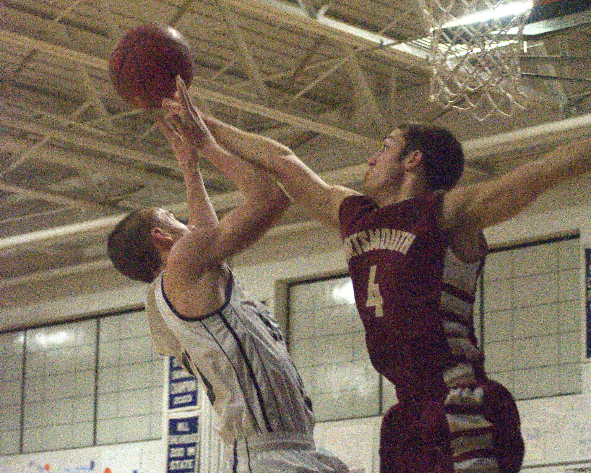 Portsmouth's Zac Hansler blocks a shot by Milford's Mitch Banuskevich during Monday's game.