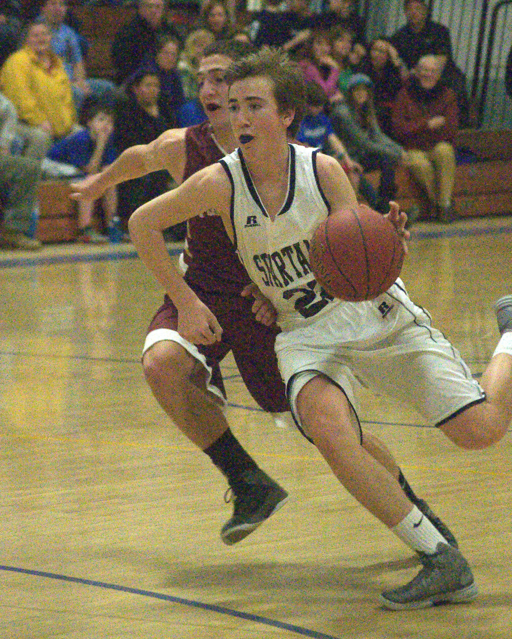 Milford's Jack Briggs drives to the basket during Monday's game.