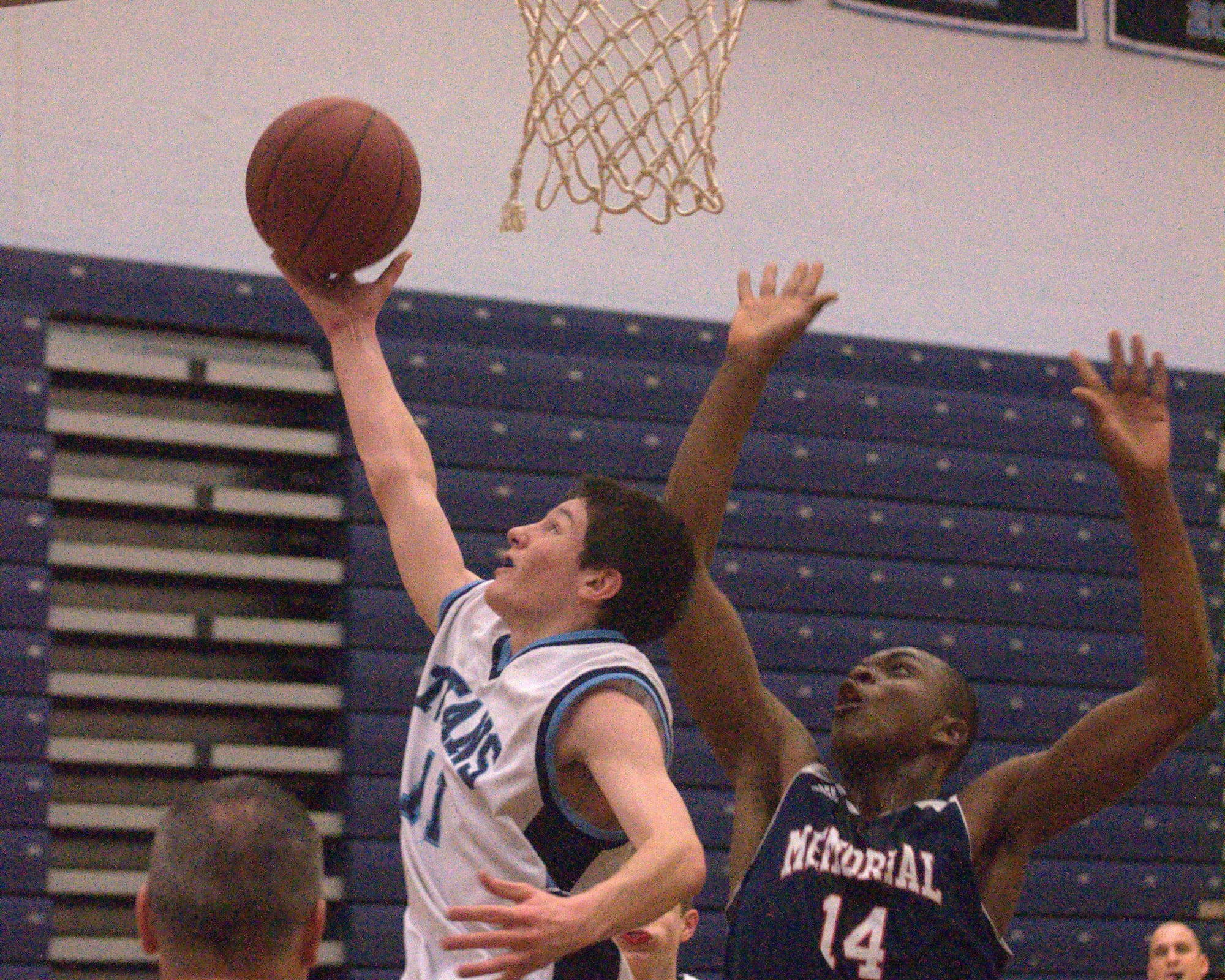 Manchester Memorial's Kabongo Ngalukukondi tries to block a shot by Nashua North's Brendan Barrett.