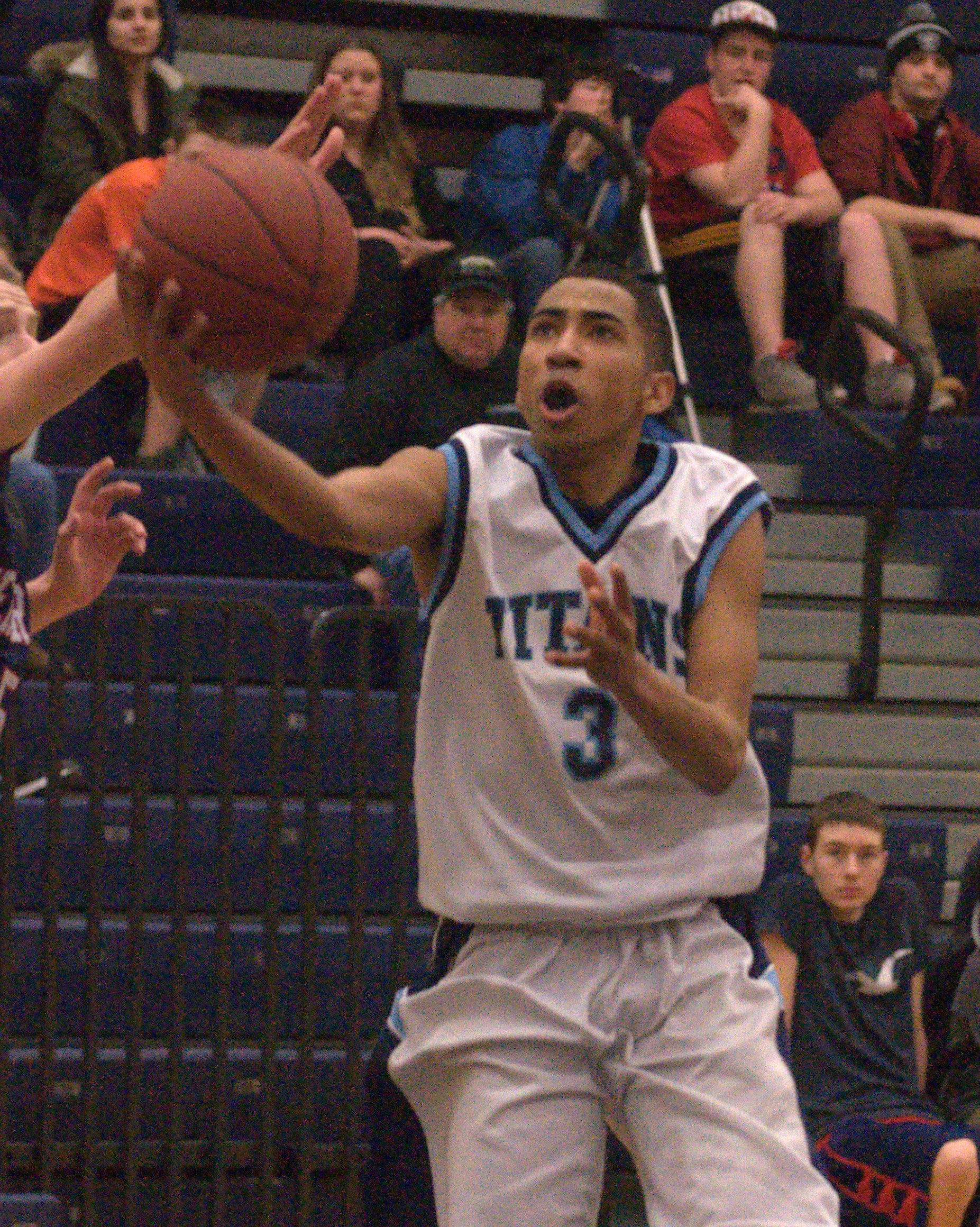 Nashua North's Jordan Lates drives to the basket for two of his 39 points.