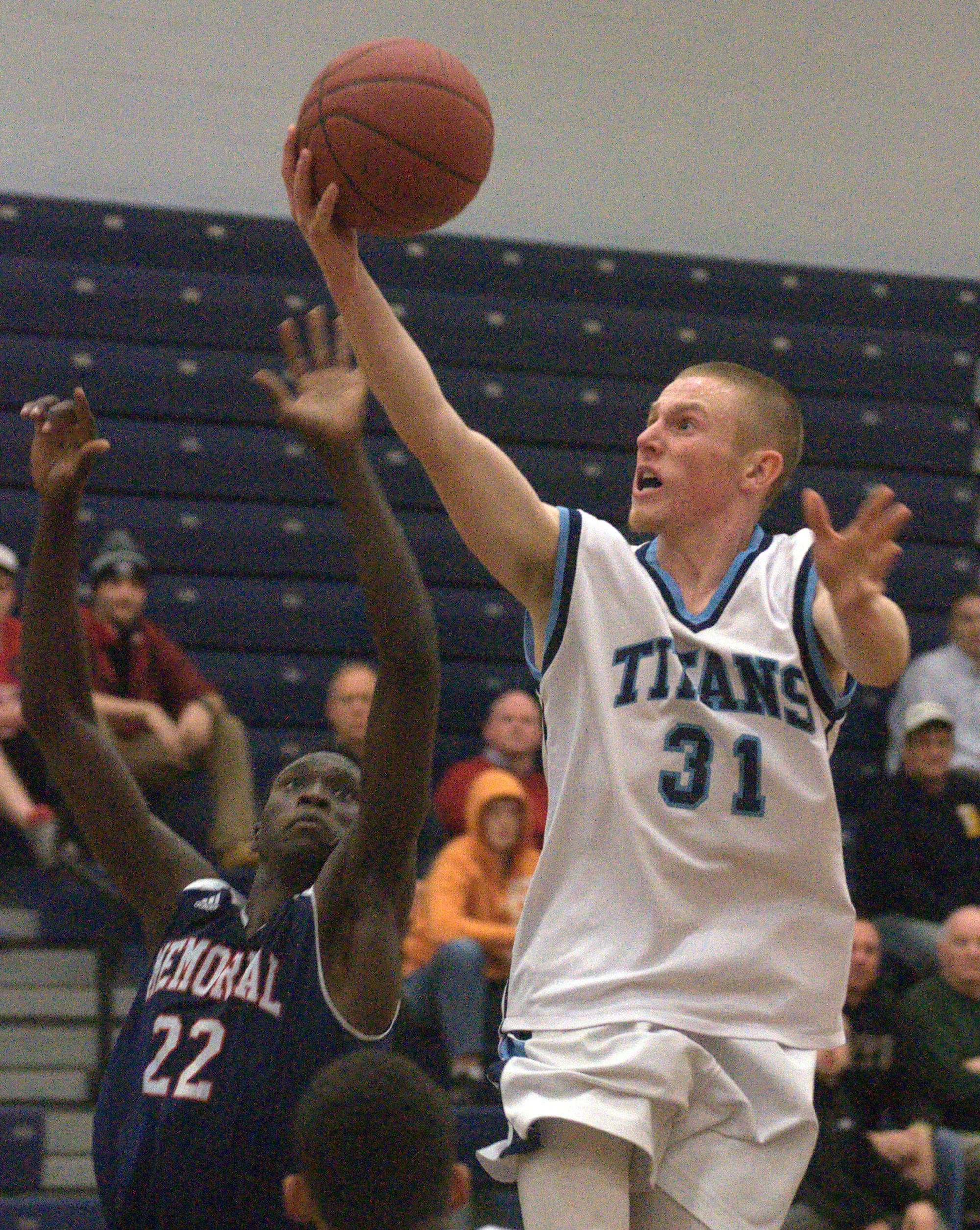 Nashua North's Drew Sheridan drives to the basket as Manchester Memorial's Malo Roumraj tries to defend during Monday's game.