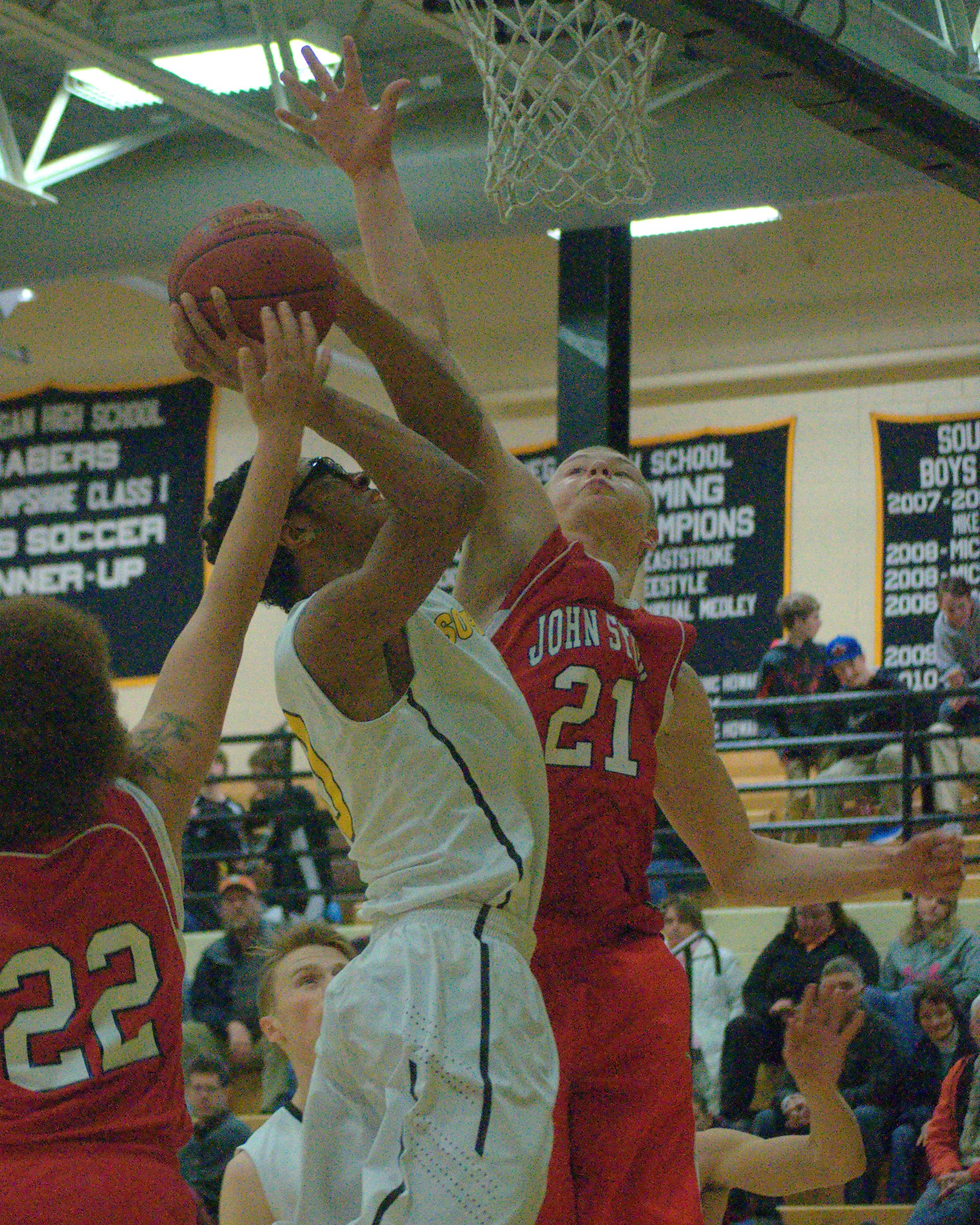 John Stark's Drew McQuarrie tries to block a shot by Souhegan's Jerrell Duguay Webster during Friday's game.
