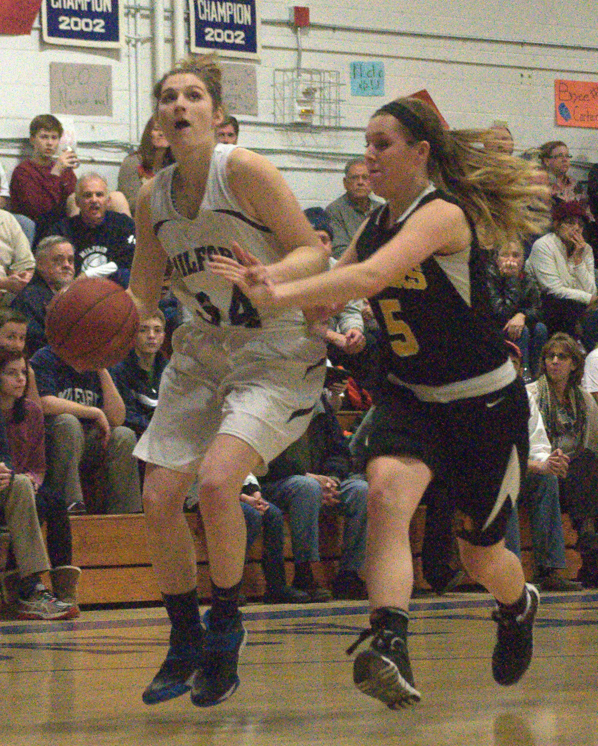 Milford's Brianna Hoffman drives to the basket as Souhegan's Jaime King defends during Thursday's game.