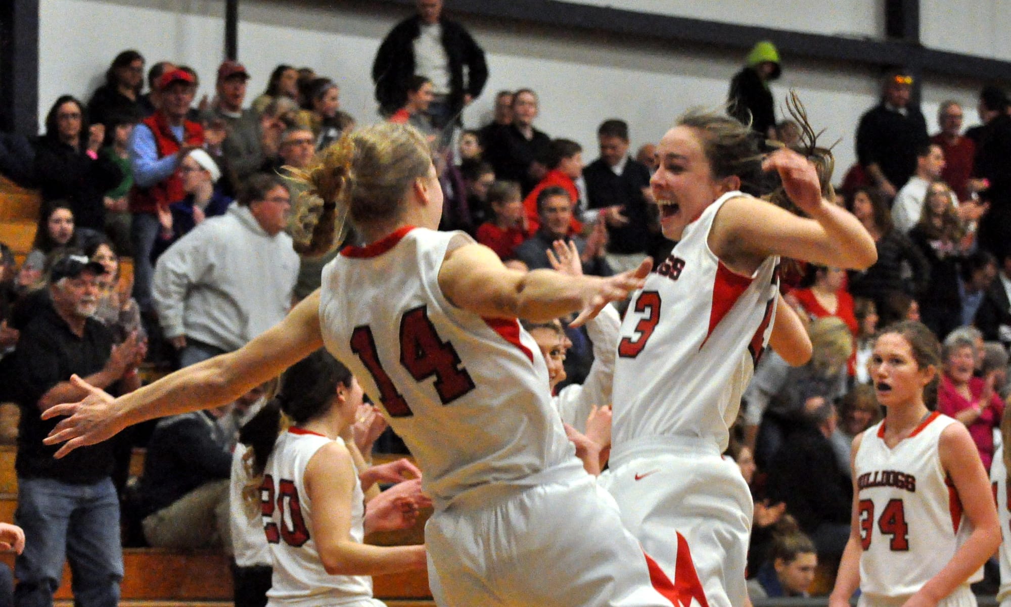 Bedford's Haley Driscoll, left, and Ali Glennon celebrate after Thursday's semifinal win over Londonderry.