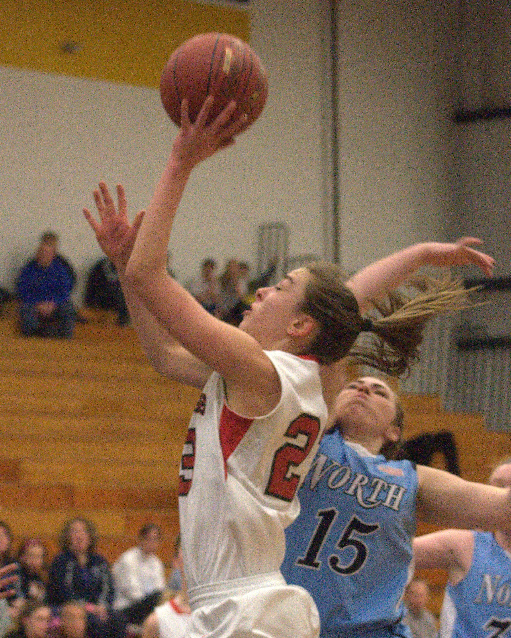 Bedford's Ali Glennon drives to the basket as Nashua North's Emily Kendall defends during Thursday's game.
