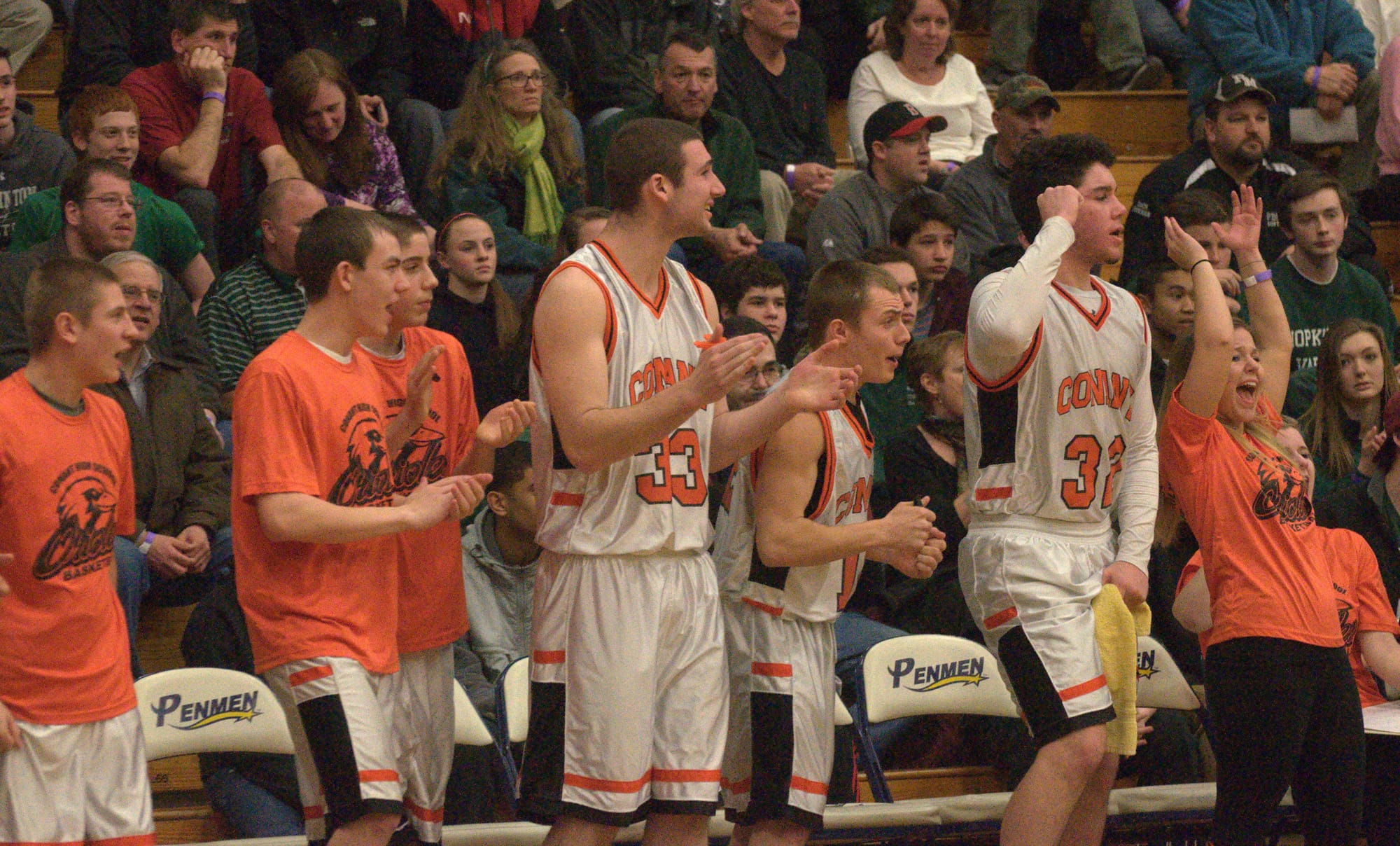 The Conant bench celebrates during the fourth quarter of Friday's game against Berlin.