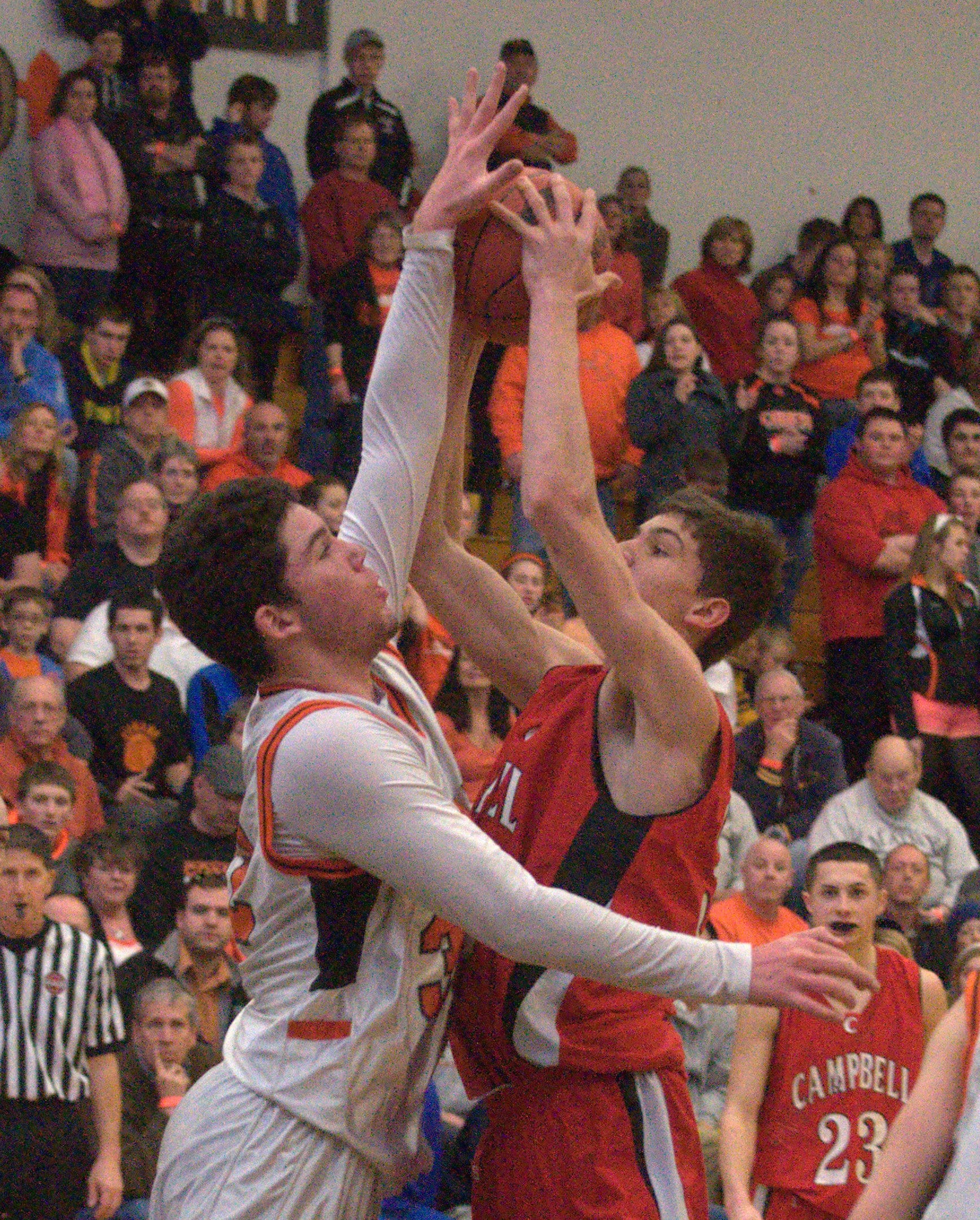 Conant's Eli Hodgson tries to block a shot by Campbell's Zach Bergeon during Sunday's championship game.