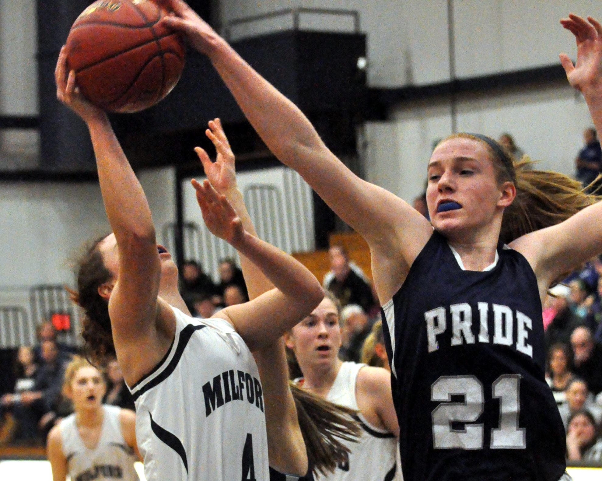 Merrimack Valley's Mayson Kimball blocks a shot by Milford's Adelle Pitsas during Monday's game.