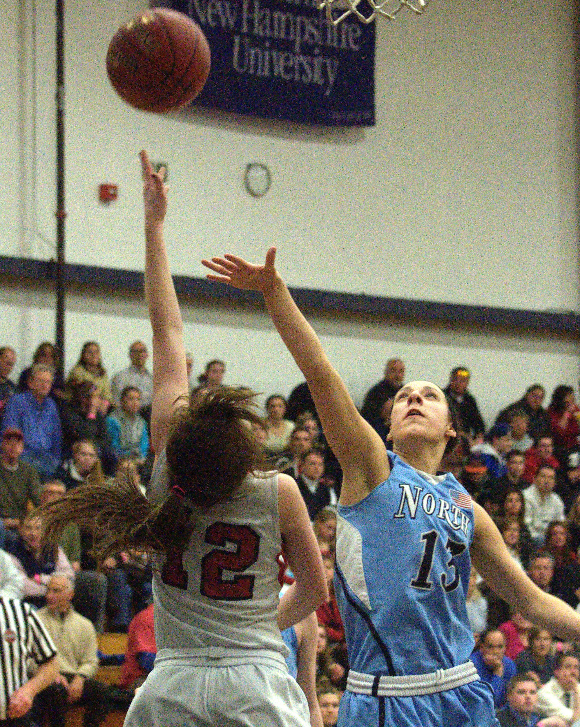 Nashua North's Brittany DesRoche tries to block a shot by Bedford's Bri Purcell.