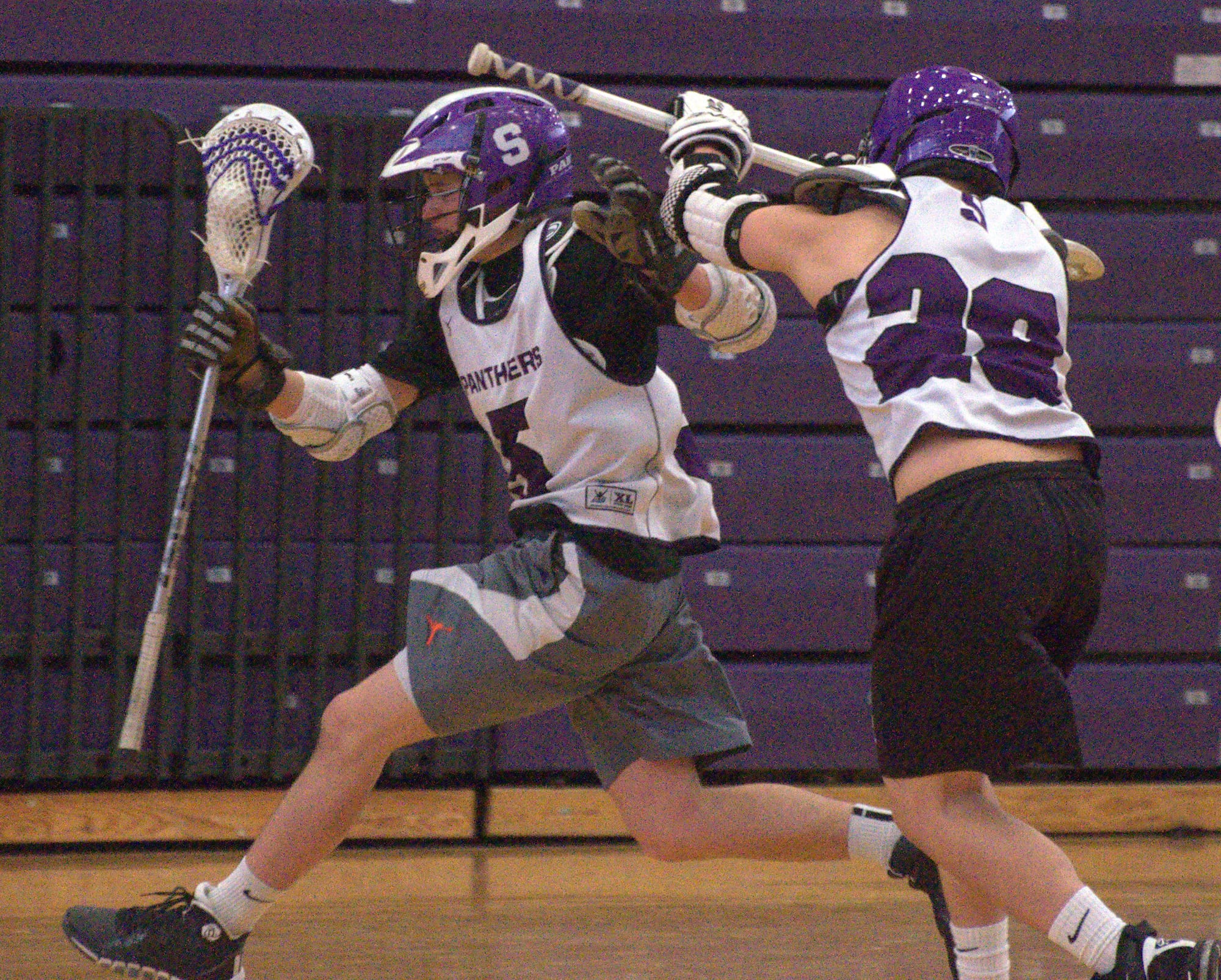 Nashua South's Josh Perry chases after teammate Collin Morrow during Thursday's practice.