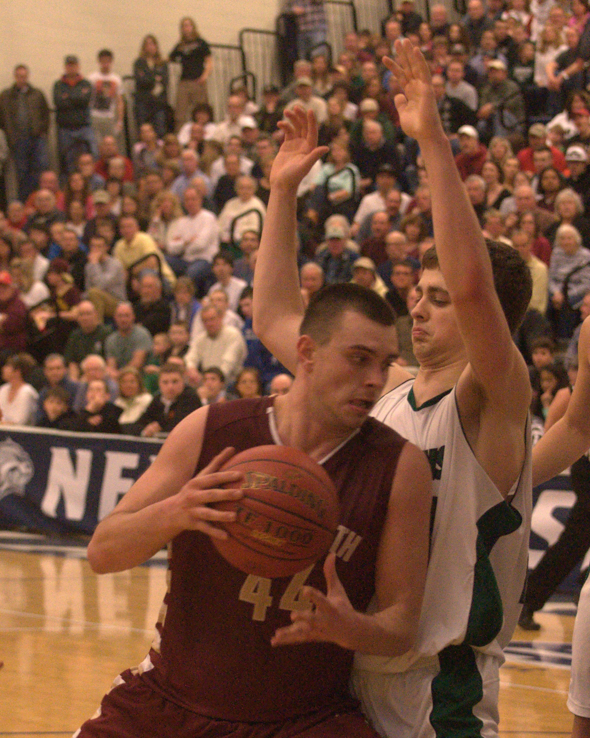 Portsmouth's Pat Glynn tries to get to the basket as Pembroke's Cameron Taylor defends.