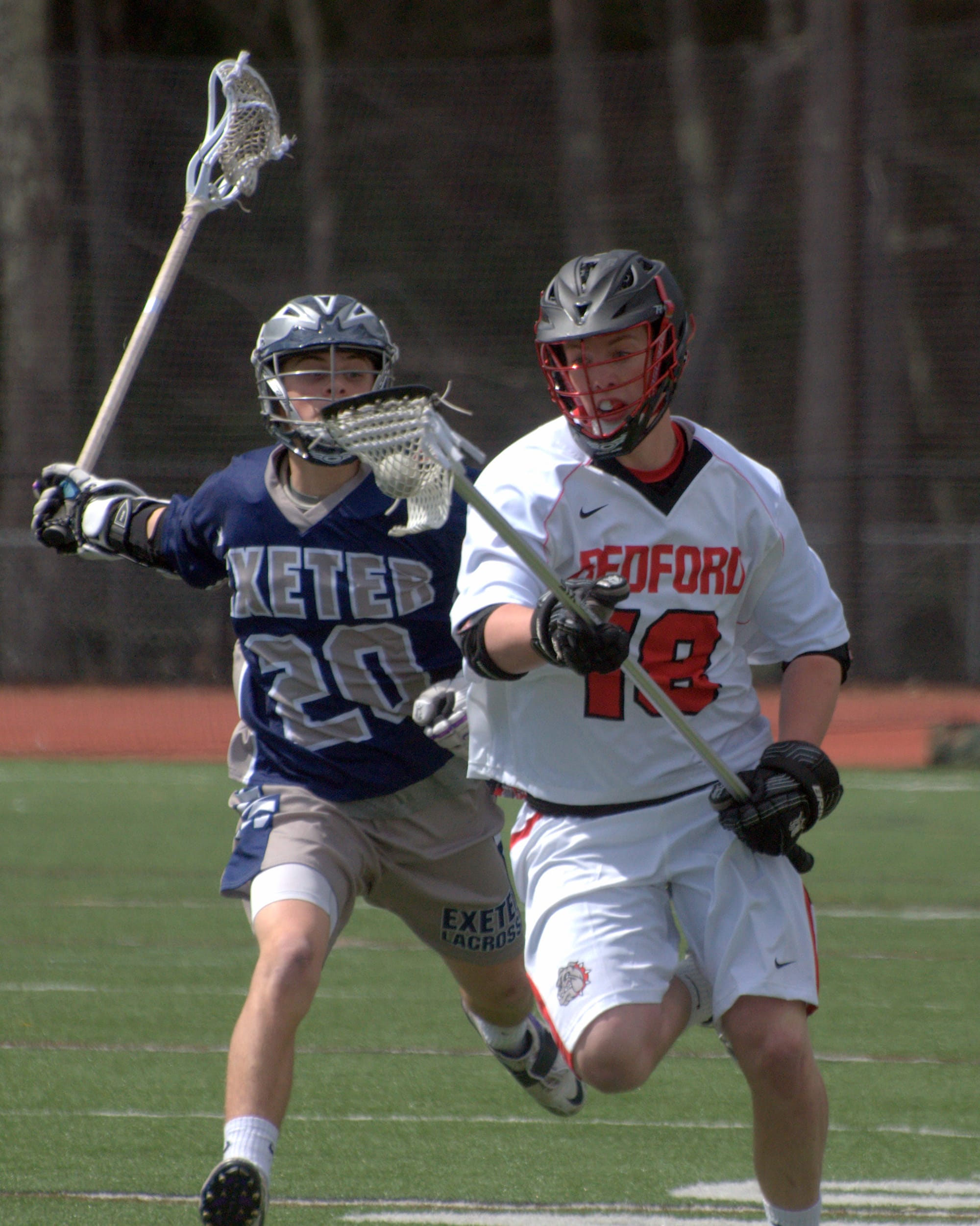 Bedford's Alexander Skillings tries to get away from Exeter's Brad Simas.