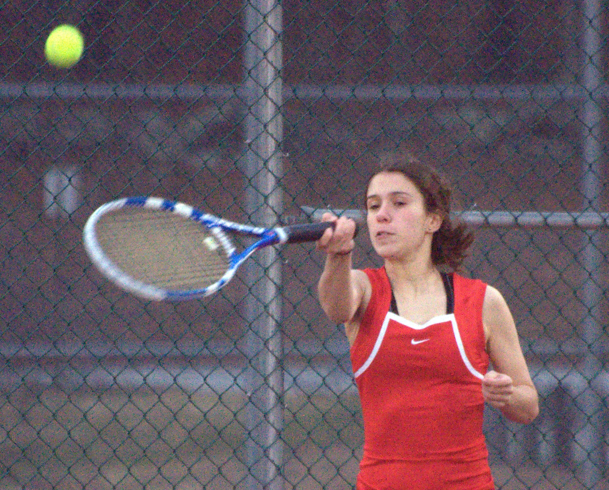 Bedford's Anna Corrao returns a shot during her doubles match against Bishop Guertin on Monday.