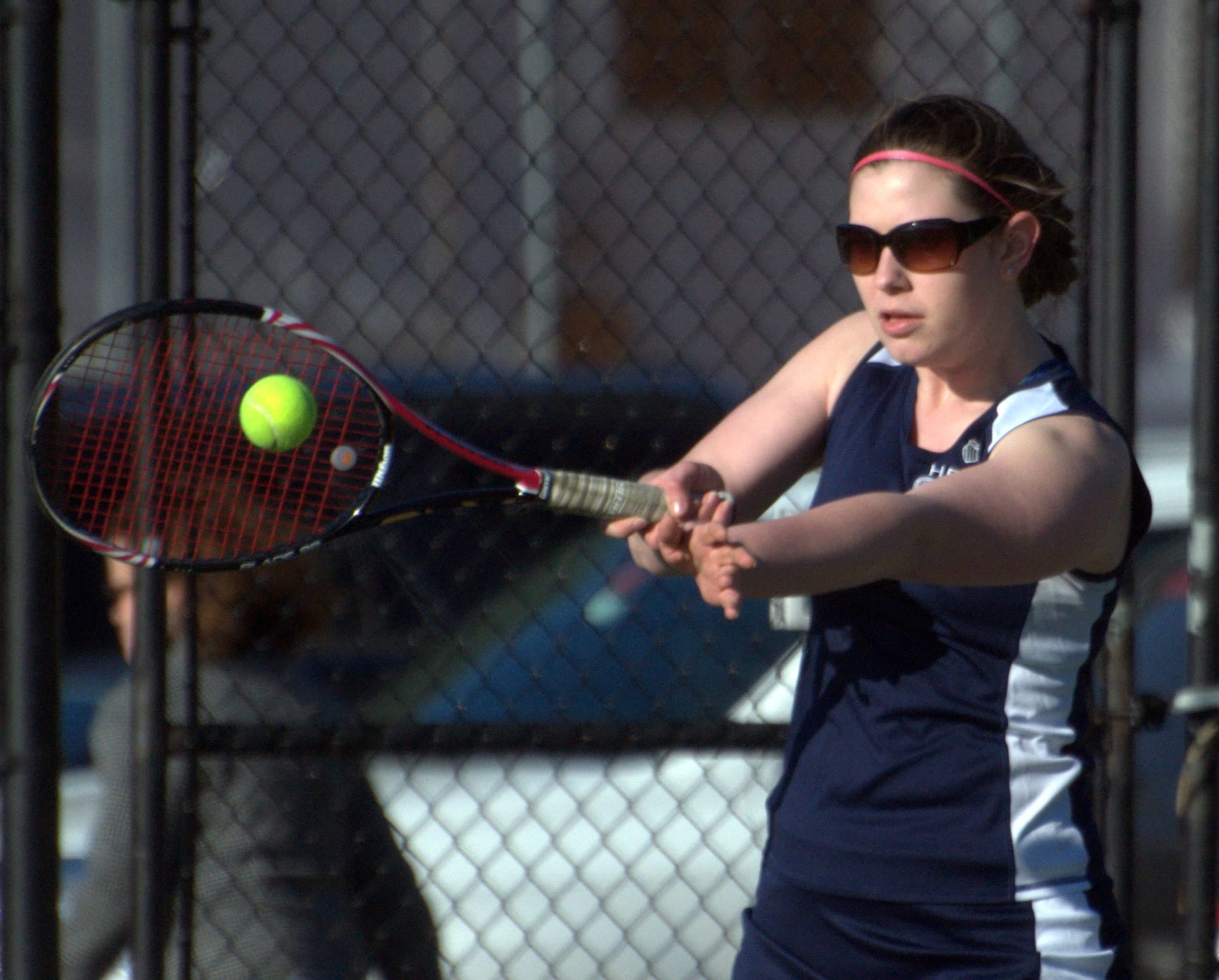 Hollis Brookline's Nicole Hall returns a shot during Wednesday's match against Souhegan.