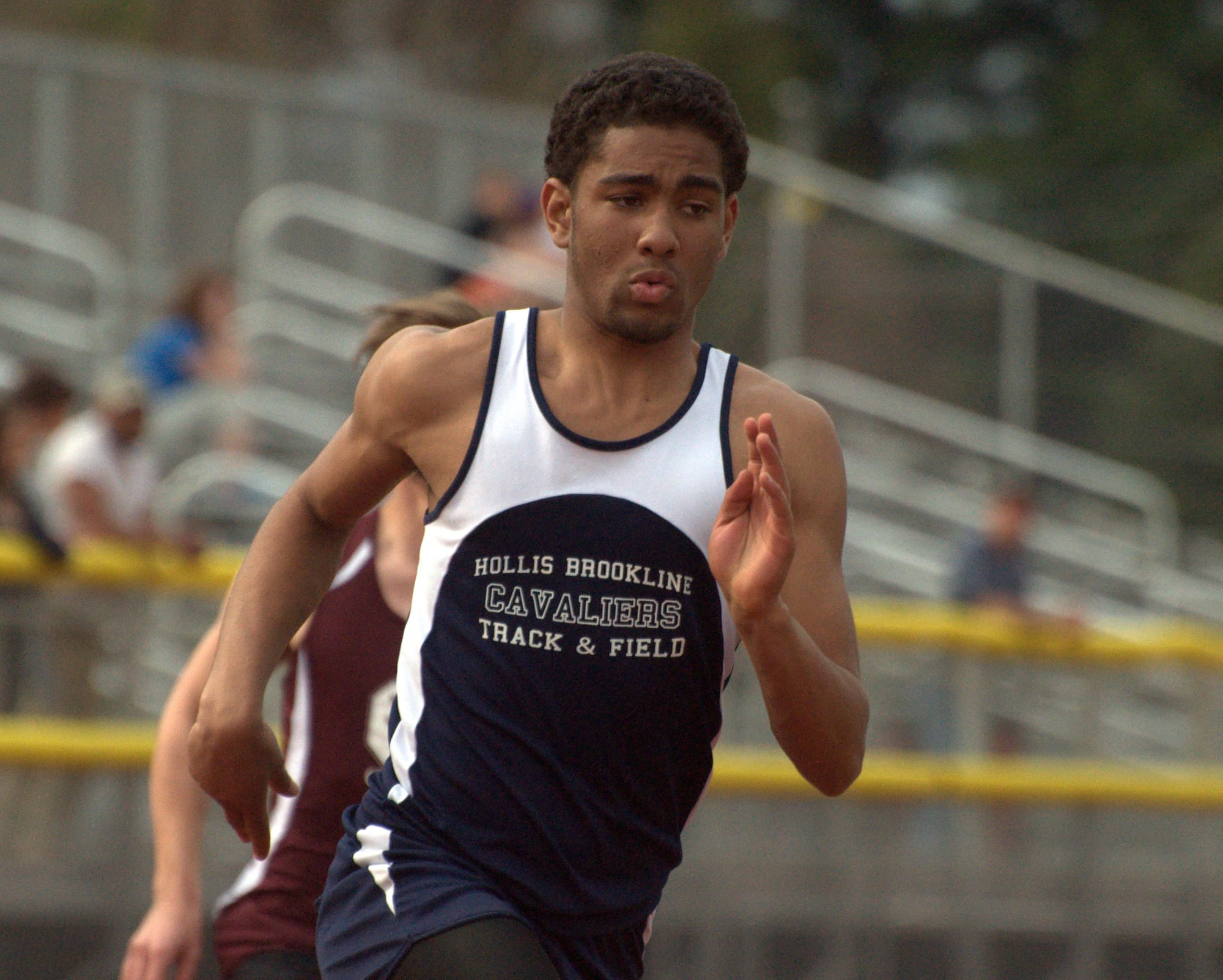 Hollis Brookline's Bryce Bowen runs the 400 at a meet last Tuesday at Milford.