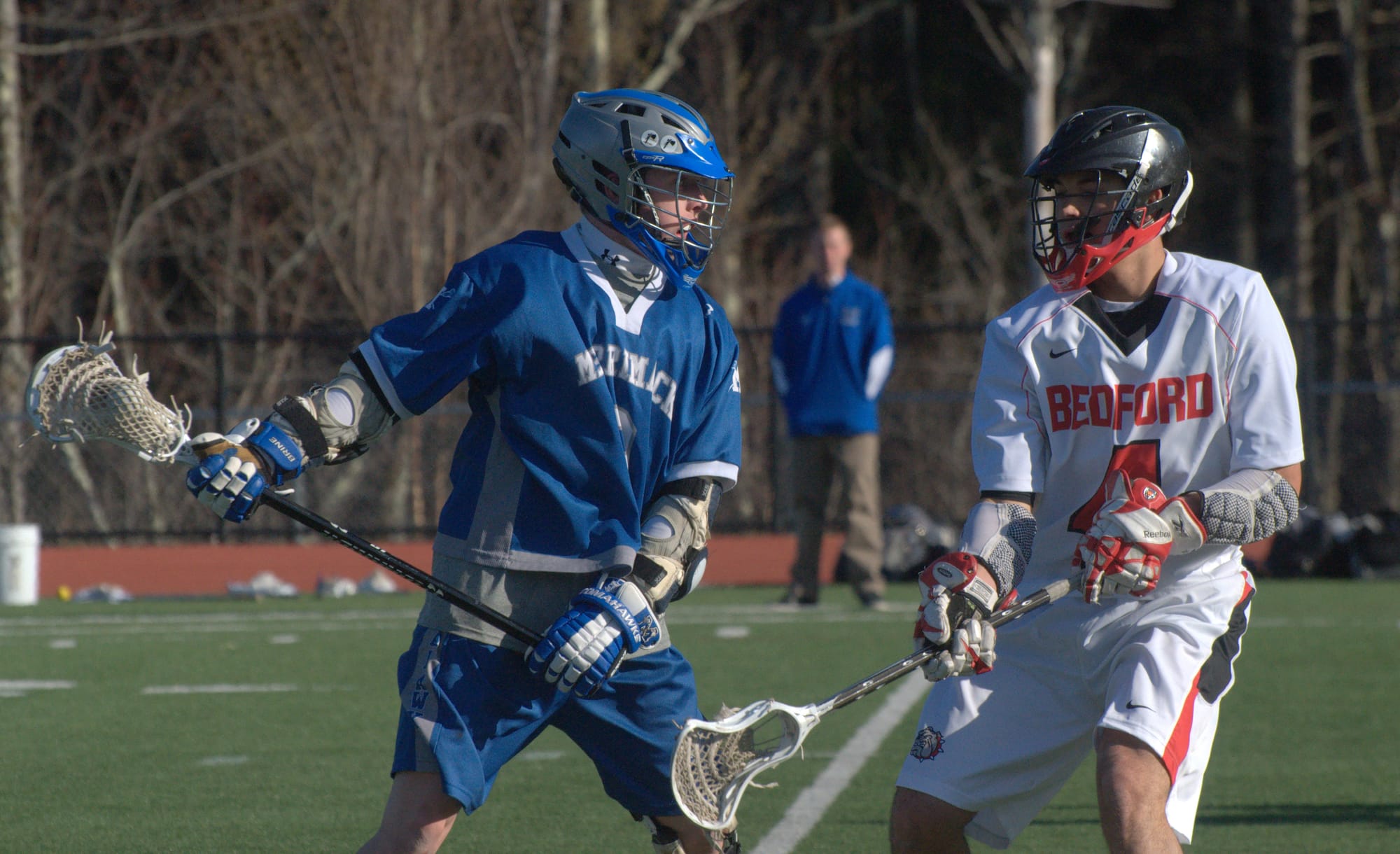 Merrimack's Connor Cyr tries to find a way around Bedford's Nicholas Vailas during Wednesday's game in Bedford.