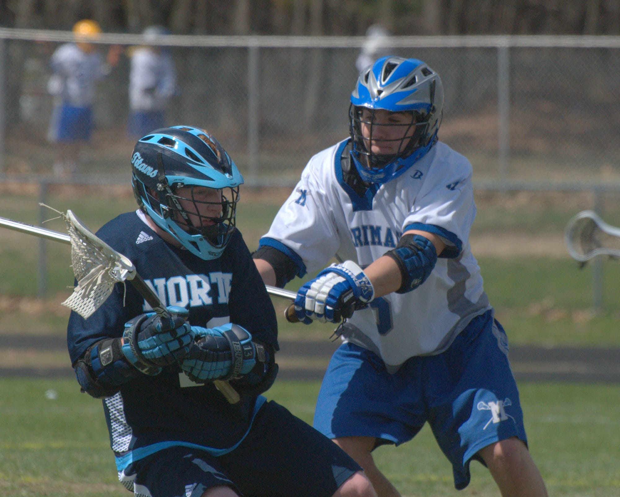 Merrimack's Thomas Perkins tries to slow down Nashua North's Jon Searles during Saturday's game.