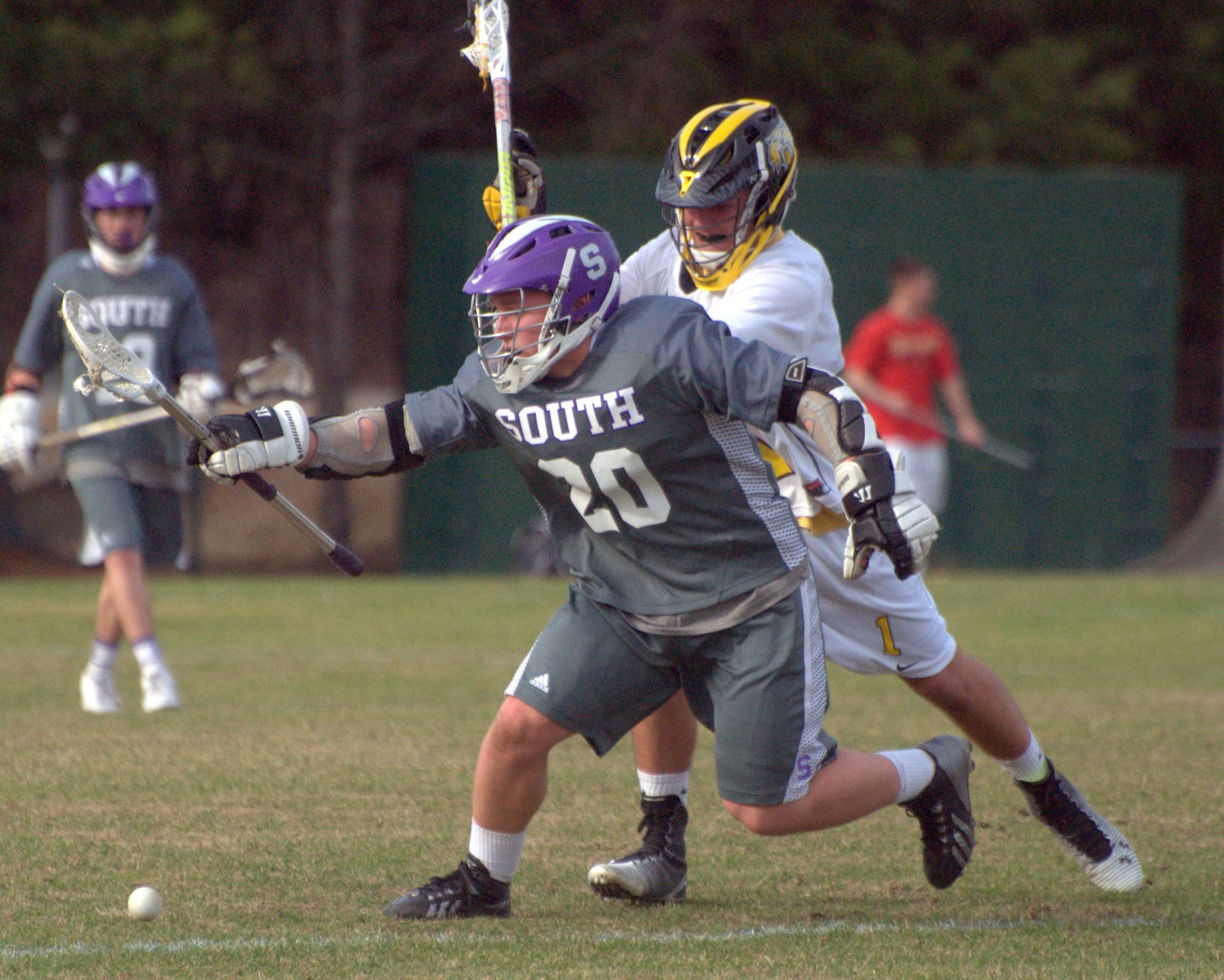 Nashua South's Andrew DeCarteret and Souhegan's Jack Rives battle for a ball.