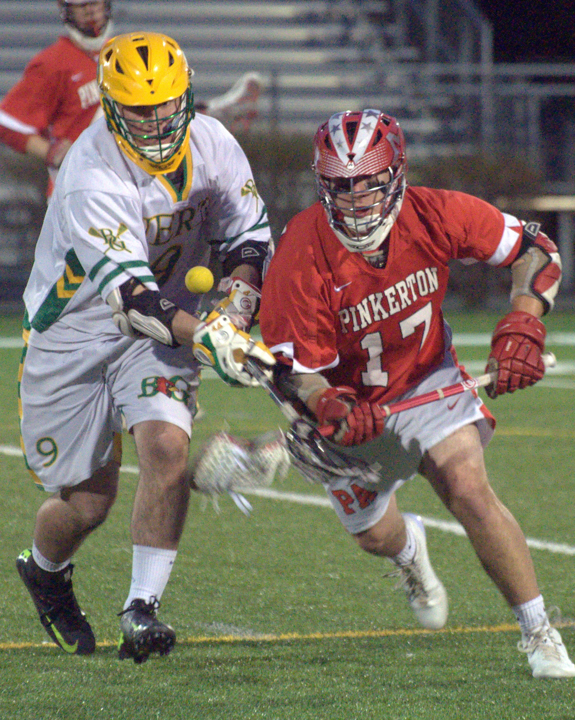 Bishop Guertin's Dillon Hayes and Pinkerotn's Austin Maylor battle for the ball.