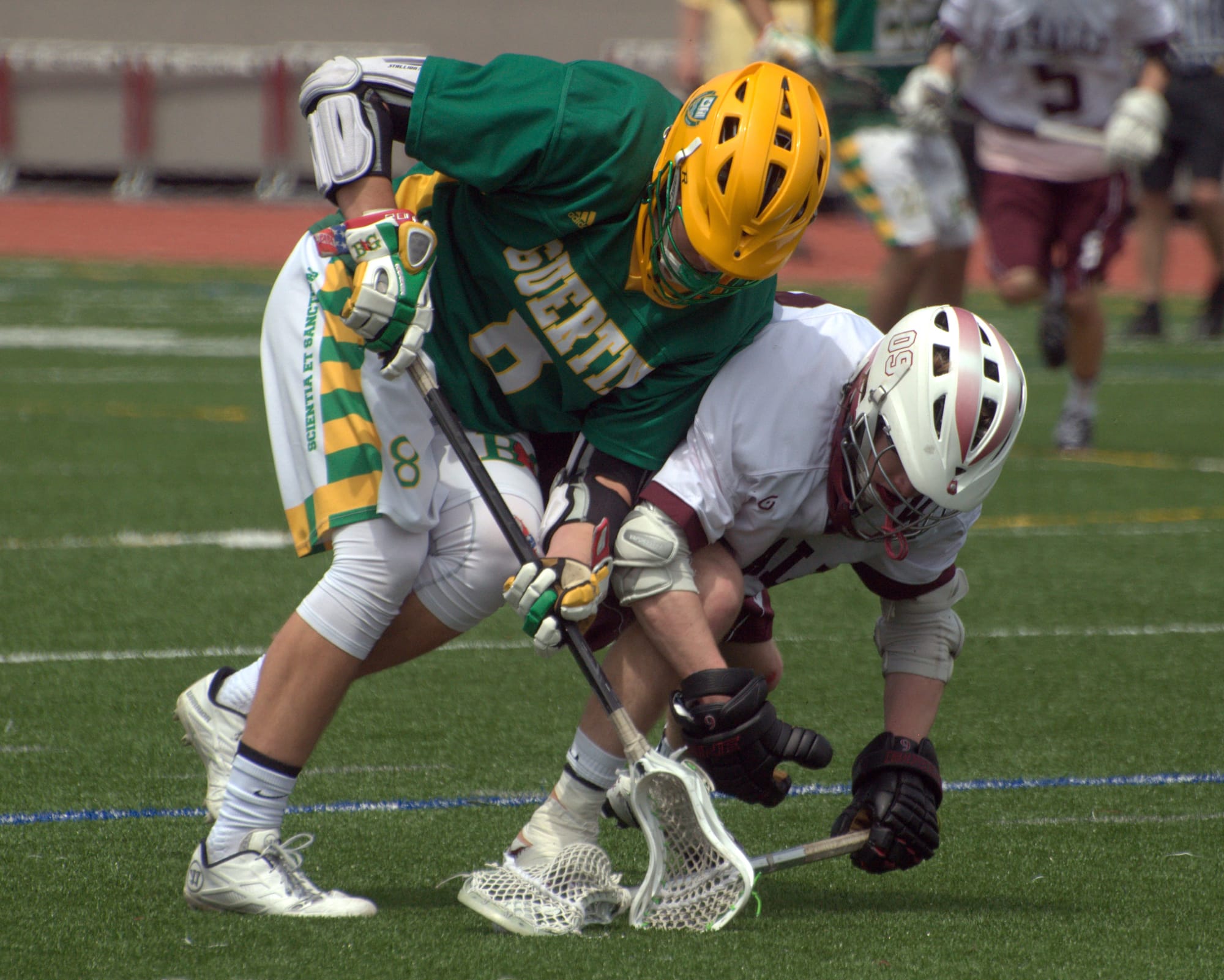 Bishop Guertin's Tom Hurley battles for the ball with a La Salle player.