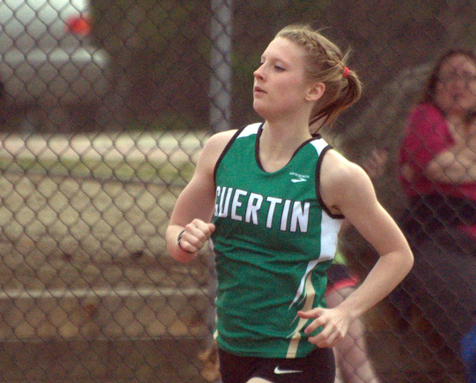Bishop Guertin's Molly McCabe runs during a track meet at Nashua South last week.