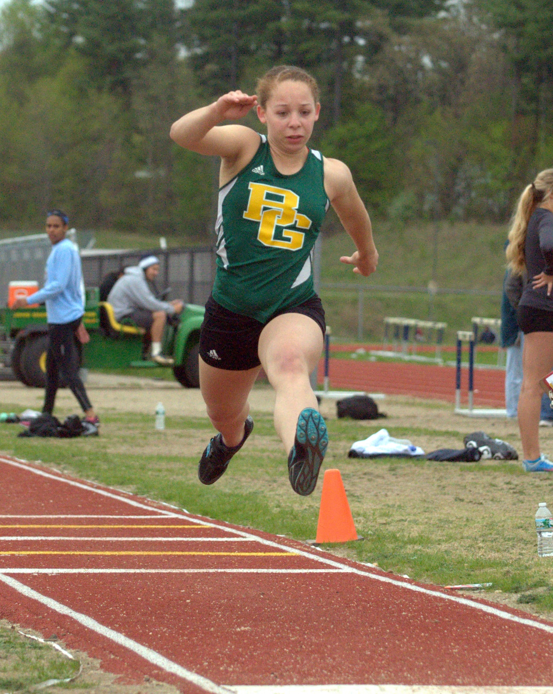 Bishop Guertin's Carolyn Nichols competes in the triple jump at a meet Tuesday.