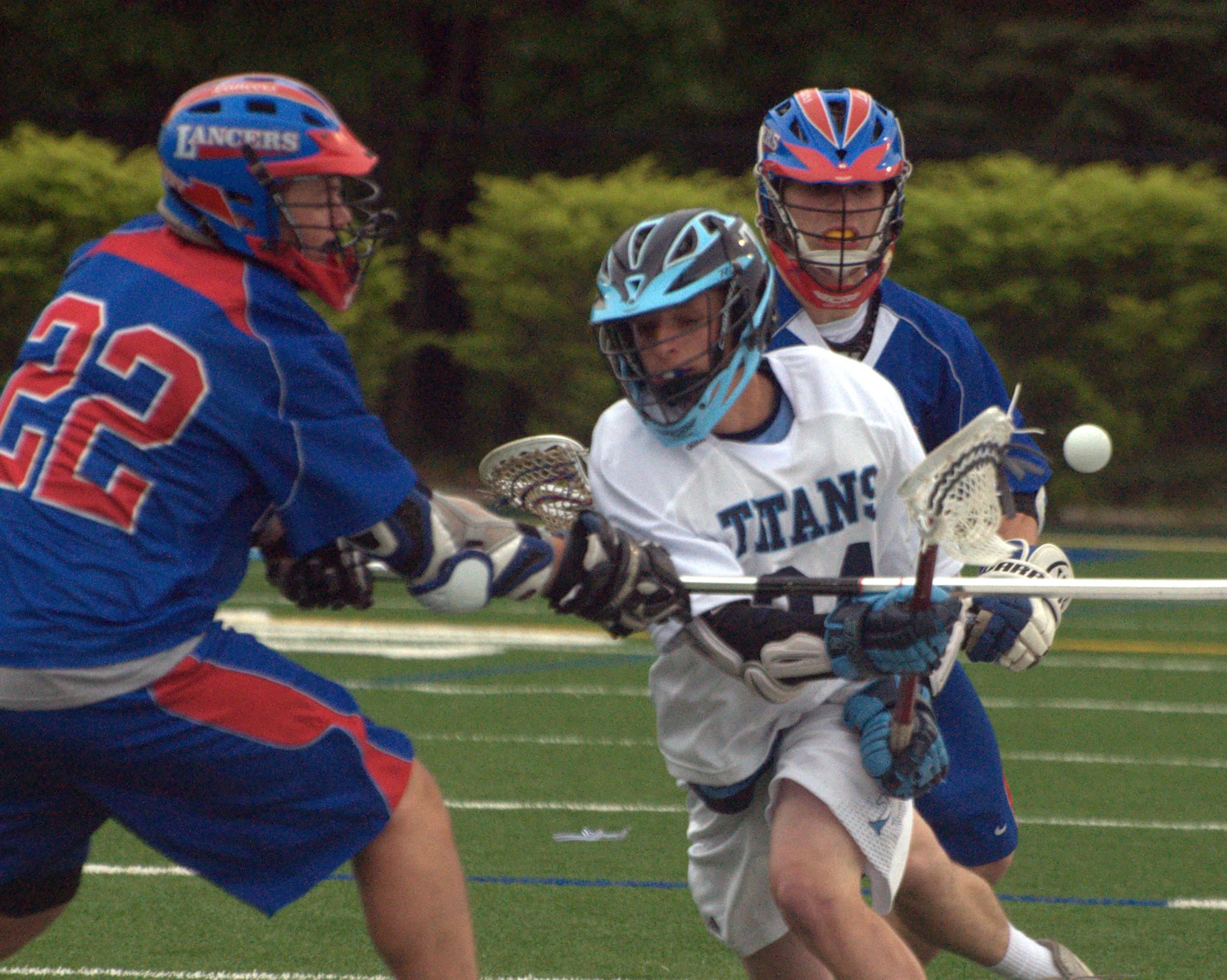 Nashua North's Jake Redman loses the ball as he's pinned against the sideline by Londonderry's Scott Beedham during Wednesday's game.