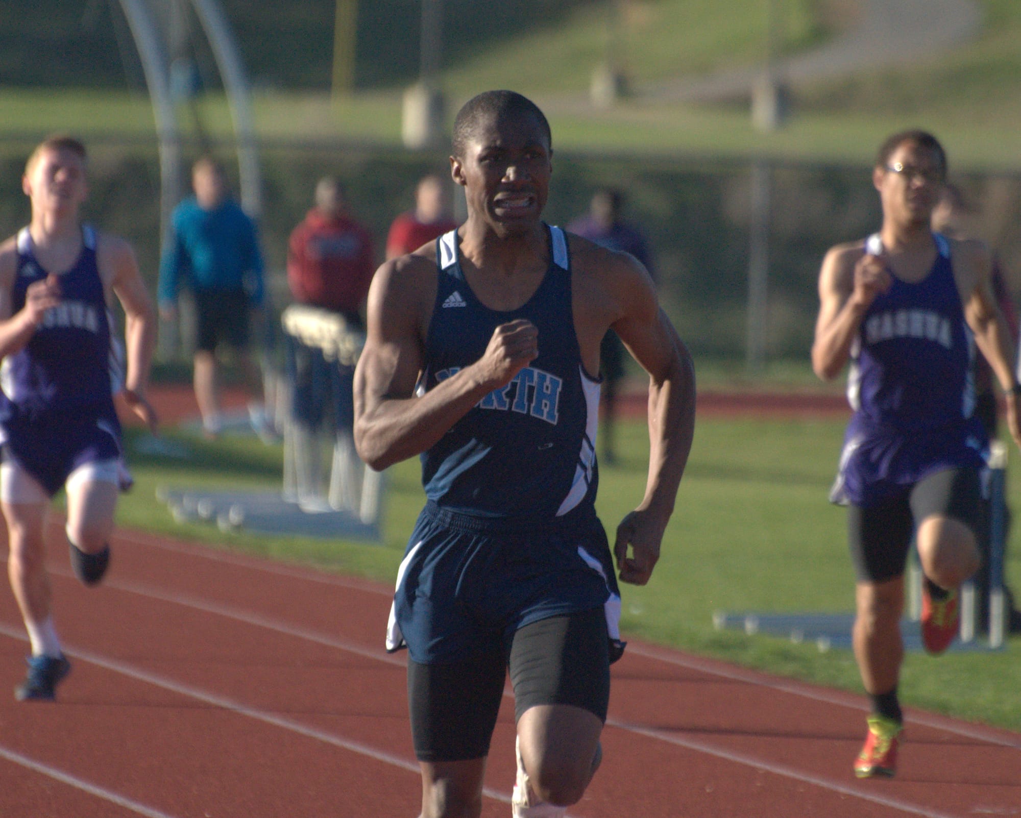 Nashua North's Zakari Jenkins runs the 200-meter dash during Tuesday's meet.
